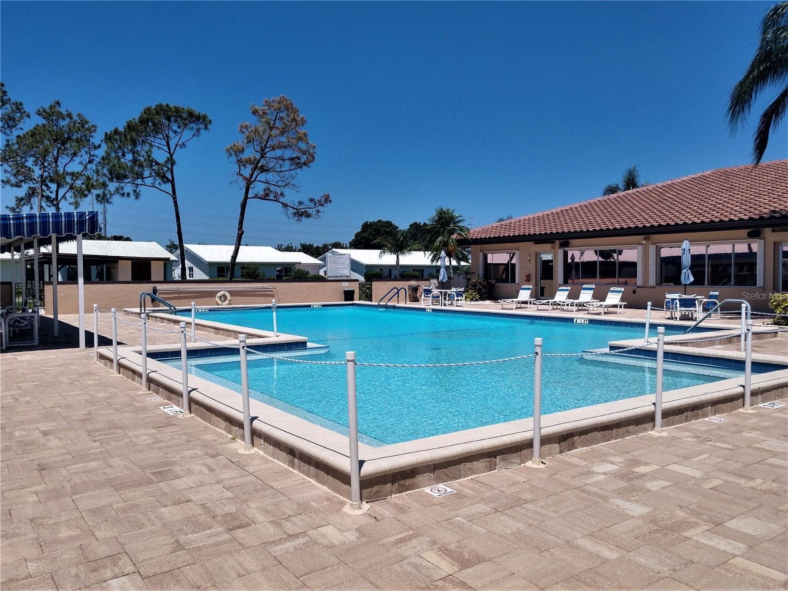 Beautiful crystal-clear, heated community pool for relaxing, exercising, cooling off or just socializing.  Lounge chairs, shower and bathroom access for residents convenience. - 9204 36TH WAY N #6, PINELLAS PARK