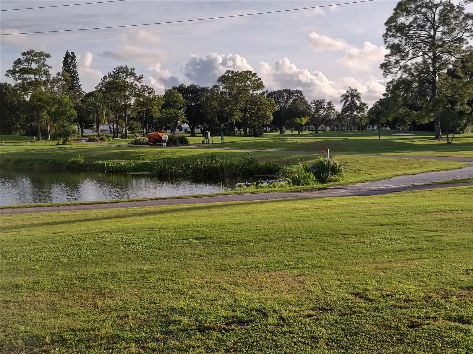 To enjoy all the golf amenities...water, sand and trees...just call to make an appointment.  Golf fees are not included in the Mainlands Maintenance Fees.  This is a public course open to everyone.  It's a beautiful course to tackle. - 9204 36TH WAY N #6, PINELLAS PARK