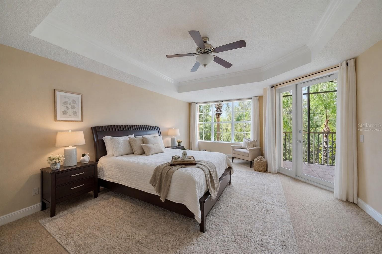 Virtually staged primary bedroom with private access to Lanai and 2 walk-in closets - 6482 WATERCREST WAY #204, LAKEWOOD RANCH