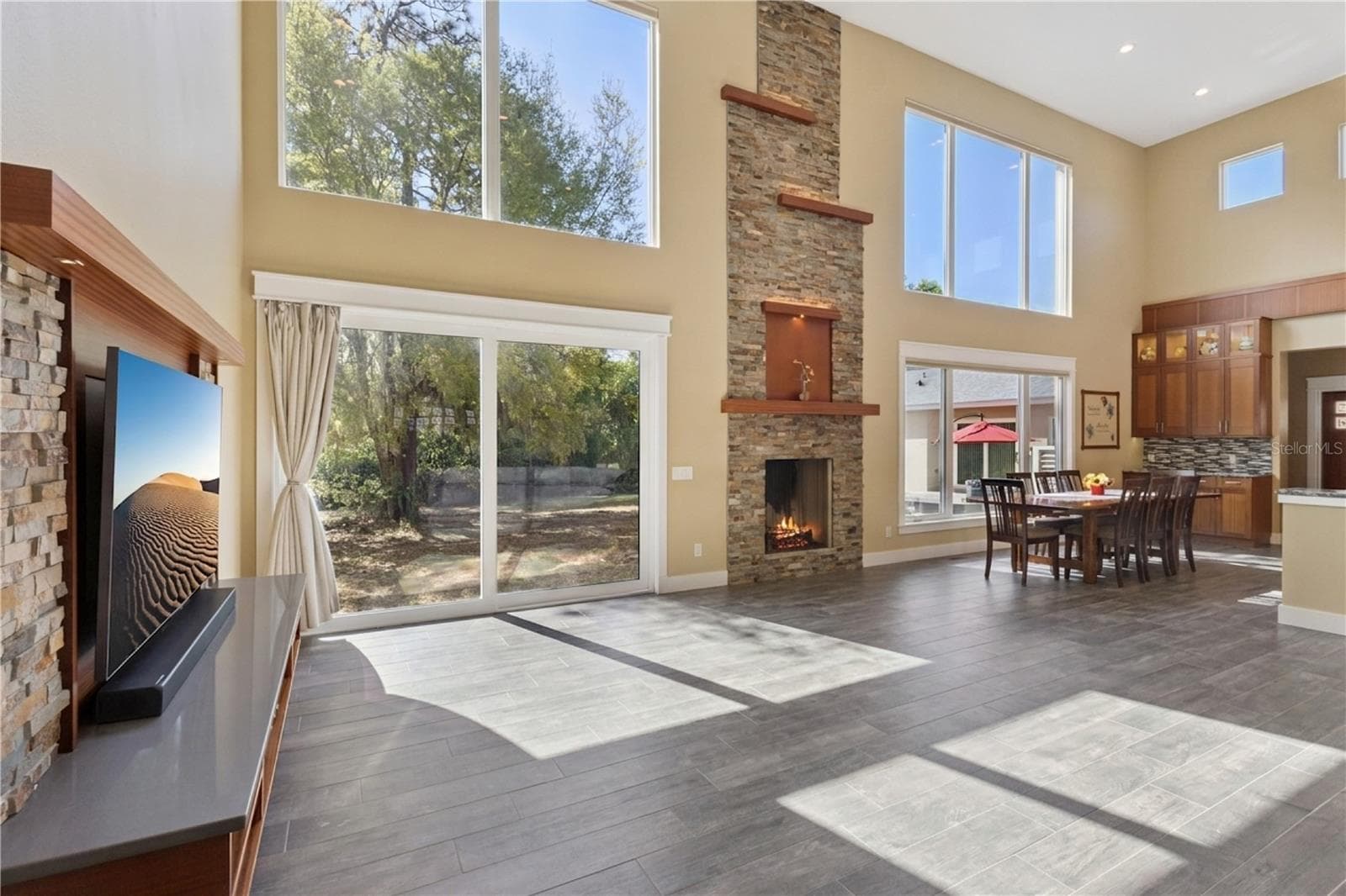 Main living area, open, light and bright with floor to ceiling windows - 15503 TROTTING HORSE LN, TAVARES