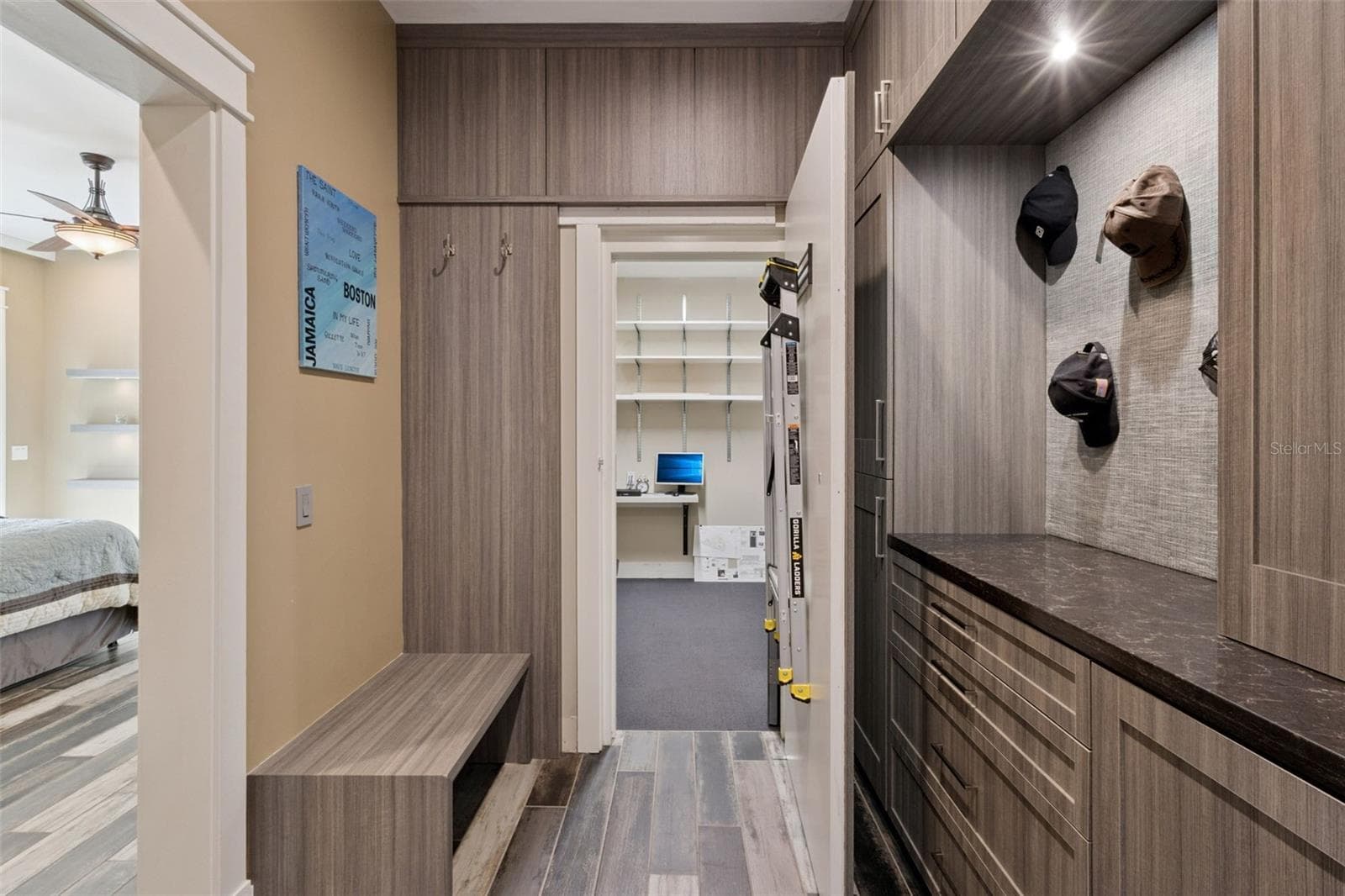 Master Bedroom custom closet with entrance to Safe Room - 15503 TROTTING HORSE LN, TAVARES