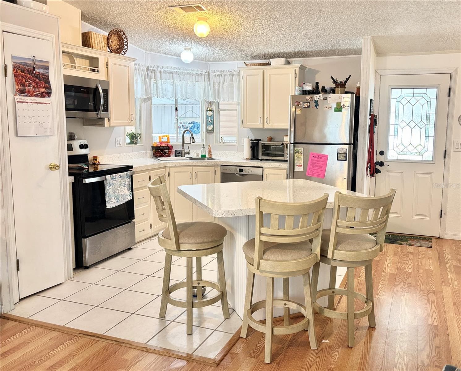 Kitchen featuring island seating - 102 AMERICANA CT NE #206, ST PETERSBURG