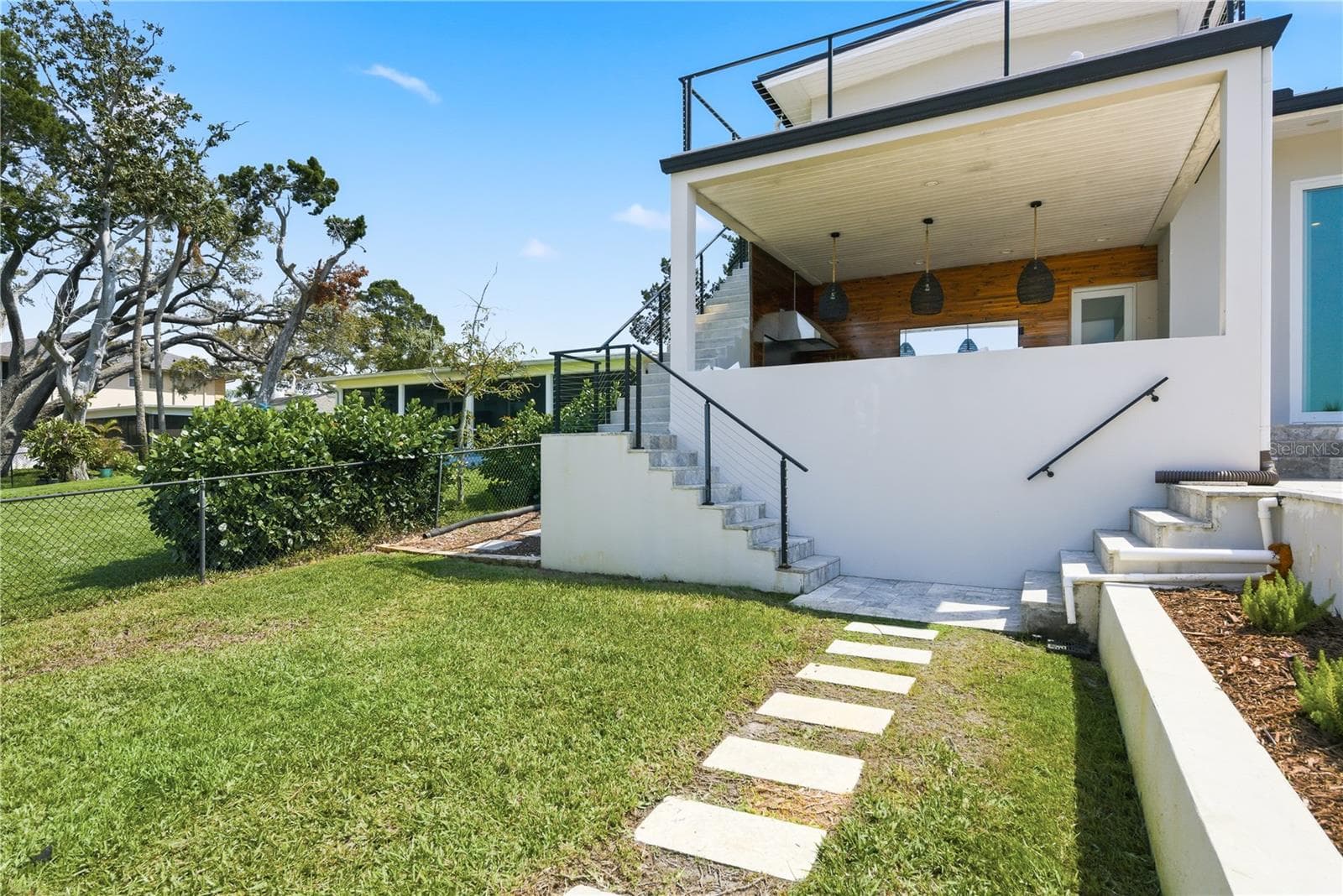 Stairway to Backyard from Cabana - 915 BAYSHORE DR, TARPON SPRINGS