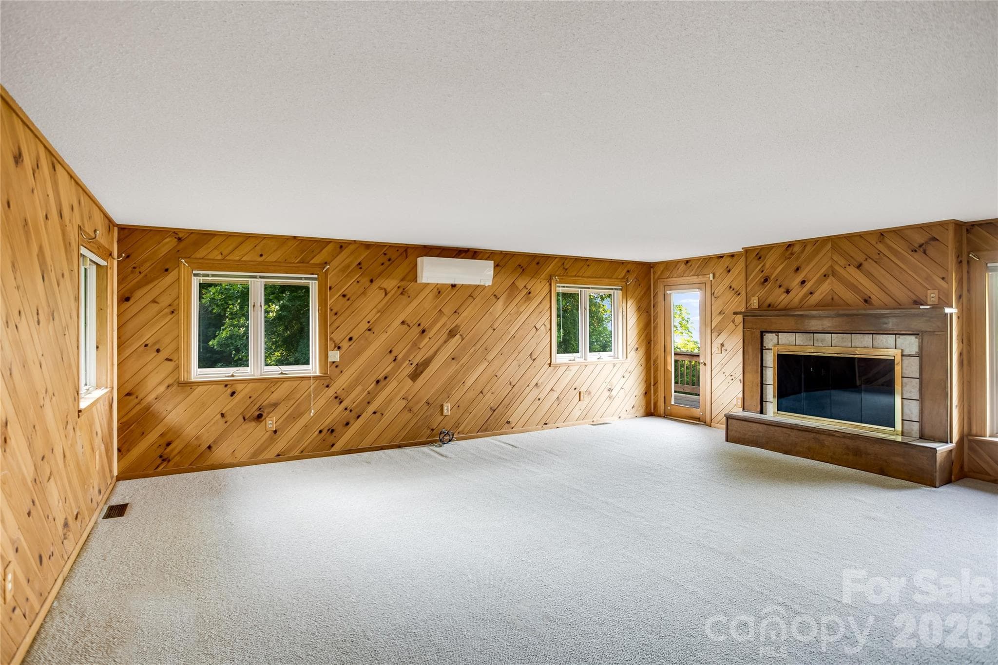 Primary bedroom with fireplace - Clyde