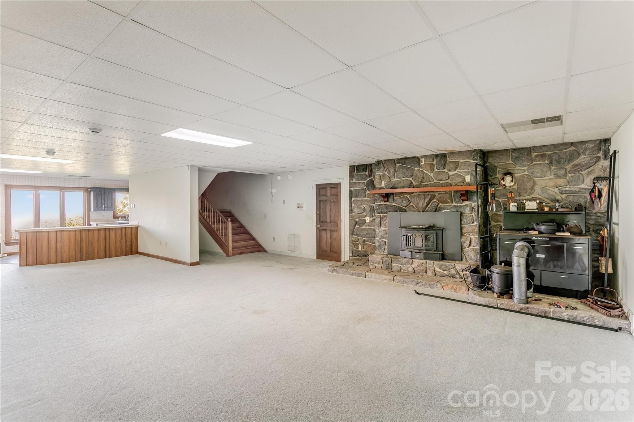 Lower level family room with fireplace - Clyde