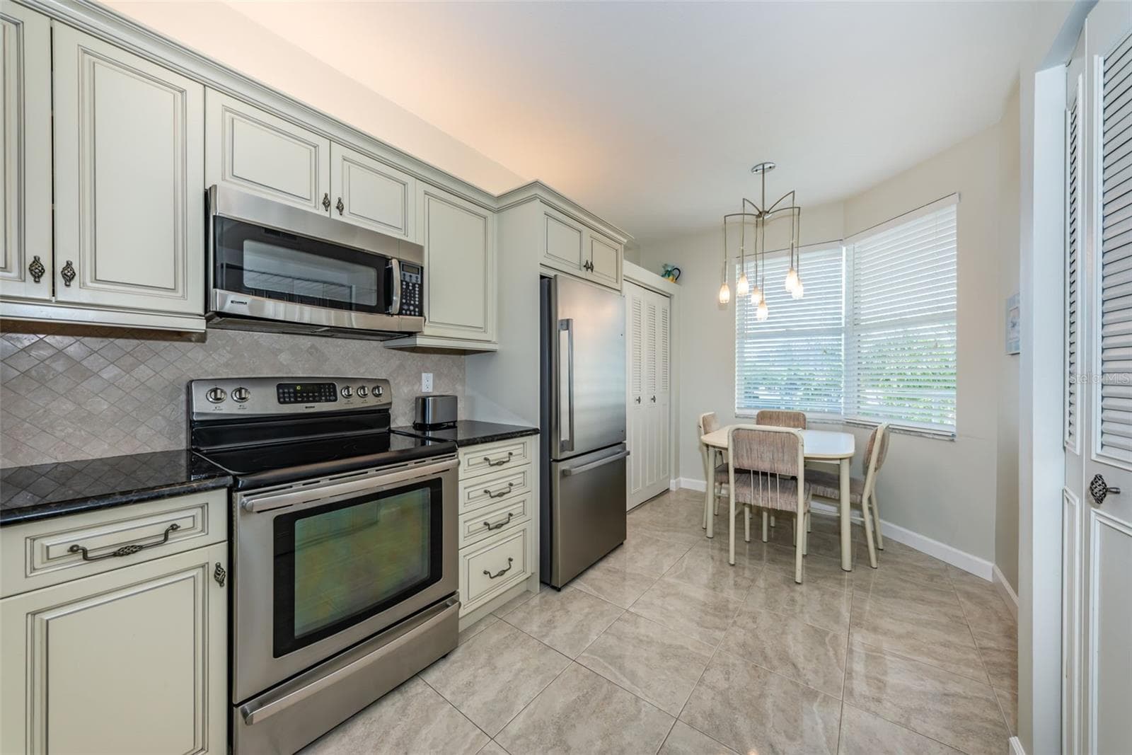 Spacious Eat-In Kitchen with Elegant Cabinetry - 7979 SAILBOAT KEY BLVD S #205, SOUTH PASADENA