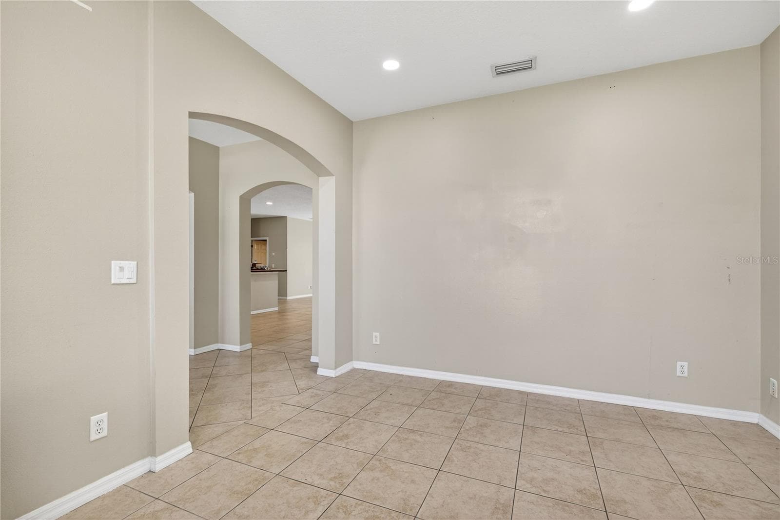 DINING ROOM ACCESS TO FOYER - 28931 BEAUCLAIRE DR, TAVARES
