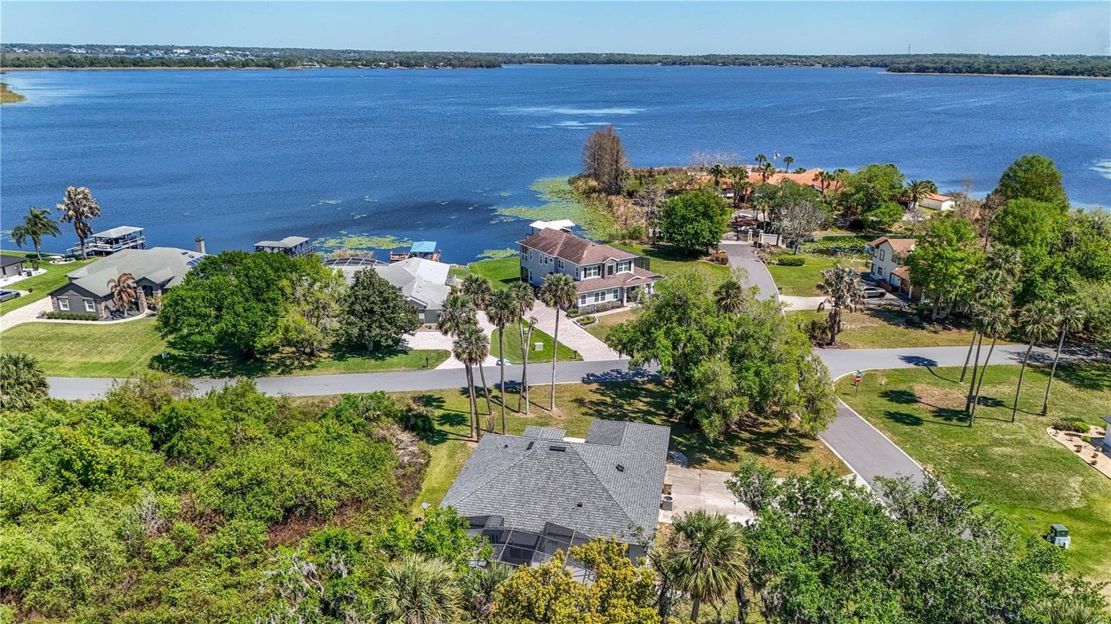 VIEW OF HOME FACING THE LAKE - 28931 BEAUCLAIRE DR, TAVARES