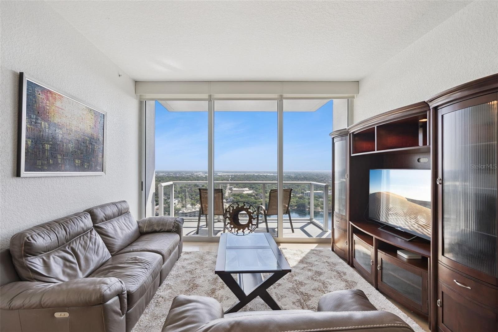 Open-concept living with floor-to-ceiling windows and breathtaking views - 150 E ROBINSON ST #2709, ORLANDO