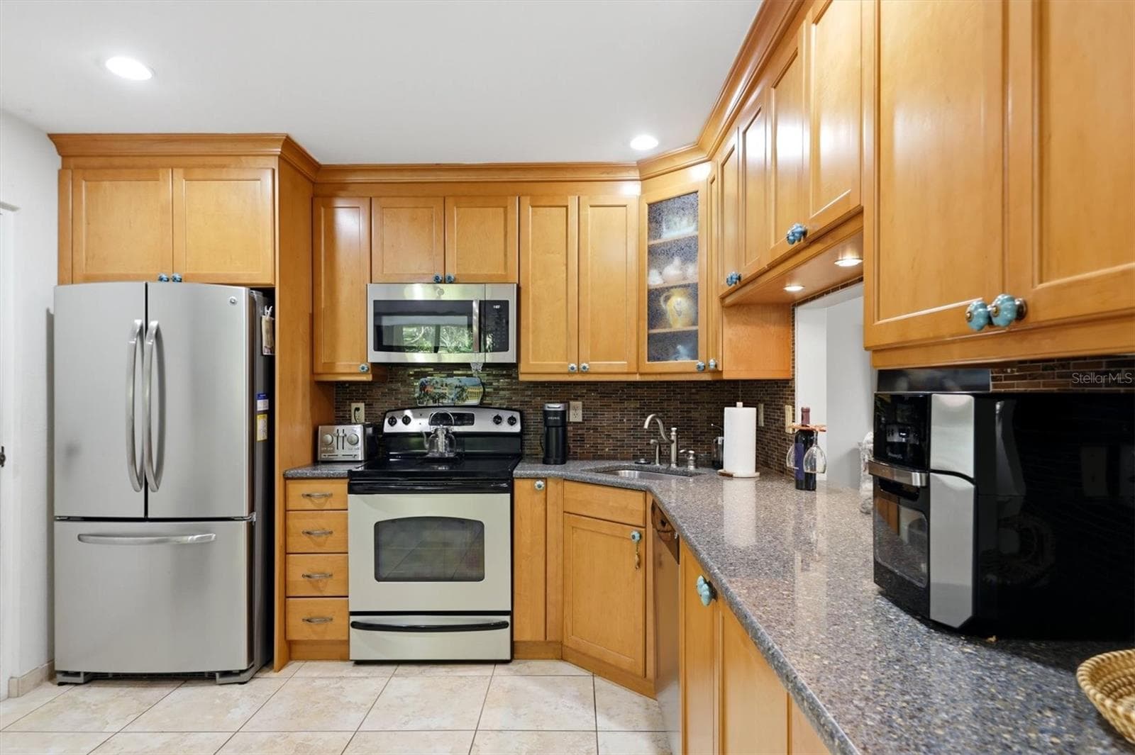 Kitchen with stainless steel appliances - 3351 THORNWOOD RD #3351, SARASOTA