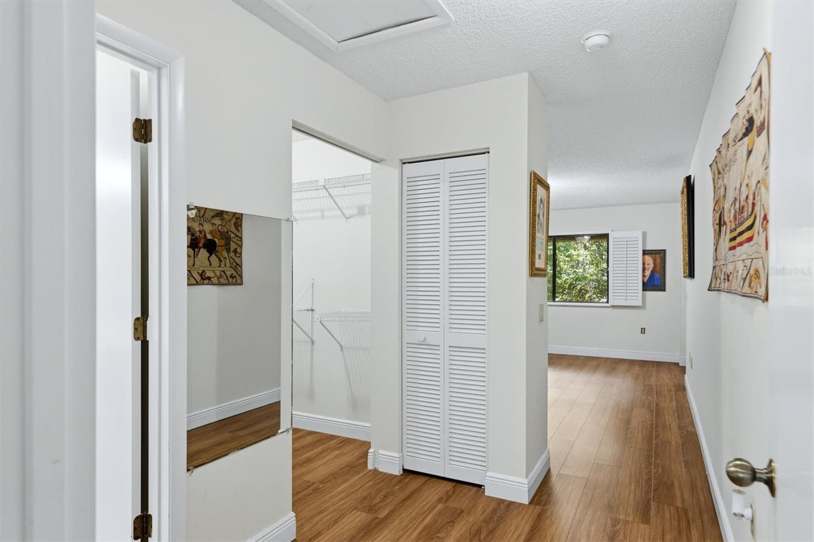 primary walk-in closet and linen closet - 3351 THORNWOOD RD #3351, SARASOTA