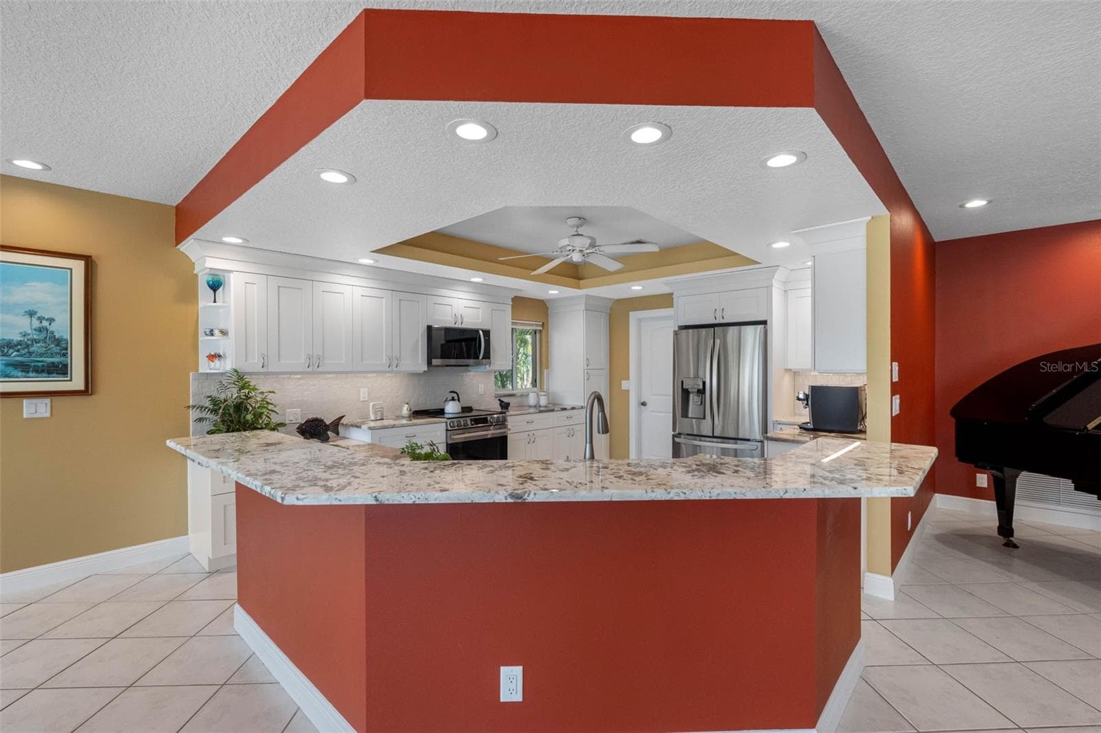 Granite bar with room for plenty of stools. - 11260 5TH ST E, TREASURE ISLAND