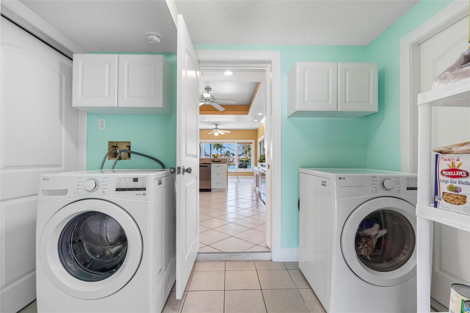 Laundry room is located right off the kitchen. - 11260 5TH ST E, TREASURE ISLAND