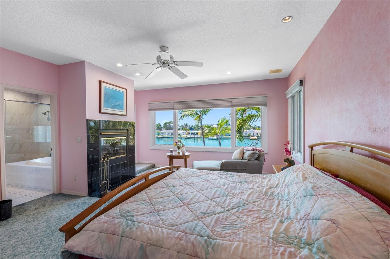 Primary has a wood burning fireplace and great water views. - 11260 5TH ST E, TREASURE ISLAND