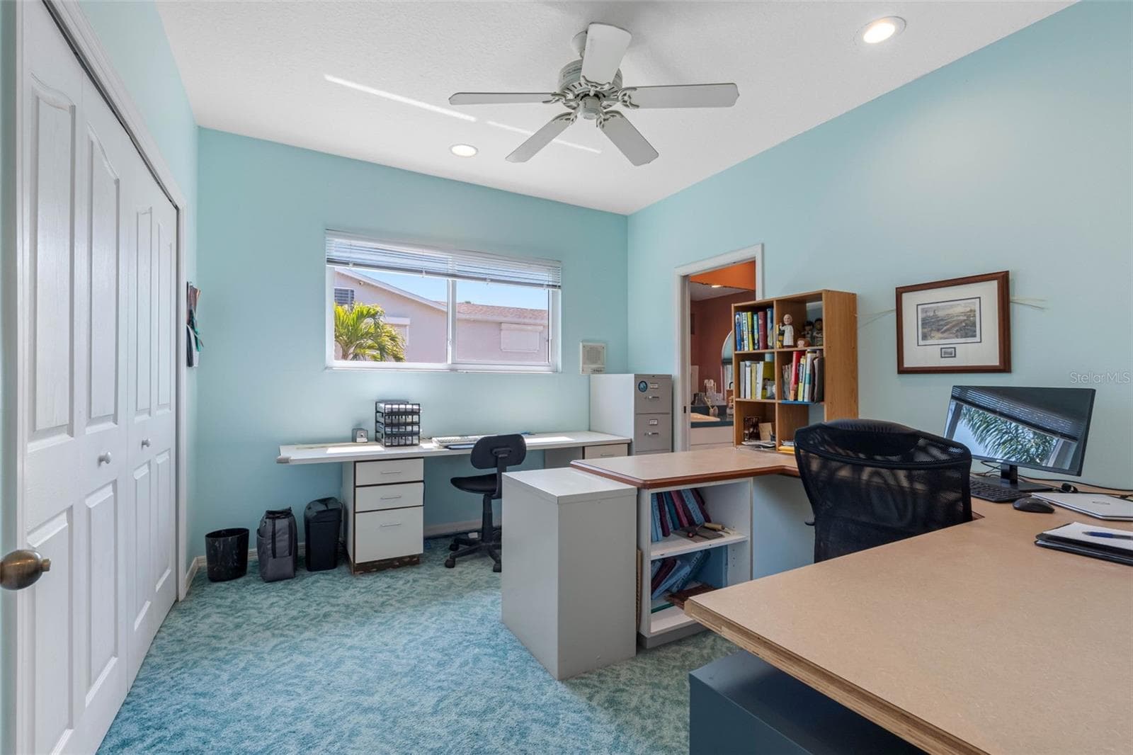 Second upstairs room, currently being used as an office. - 11260 5TH ST E, TREASURE ISLAND