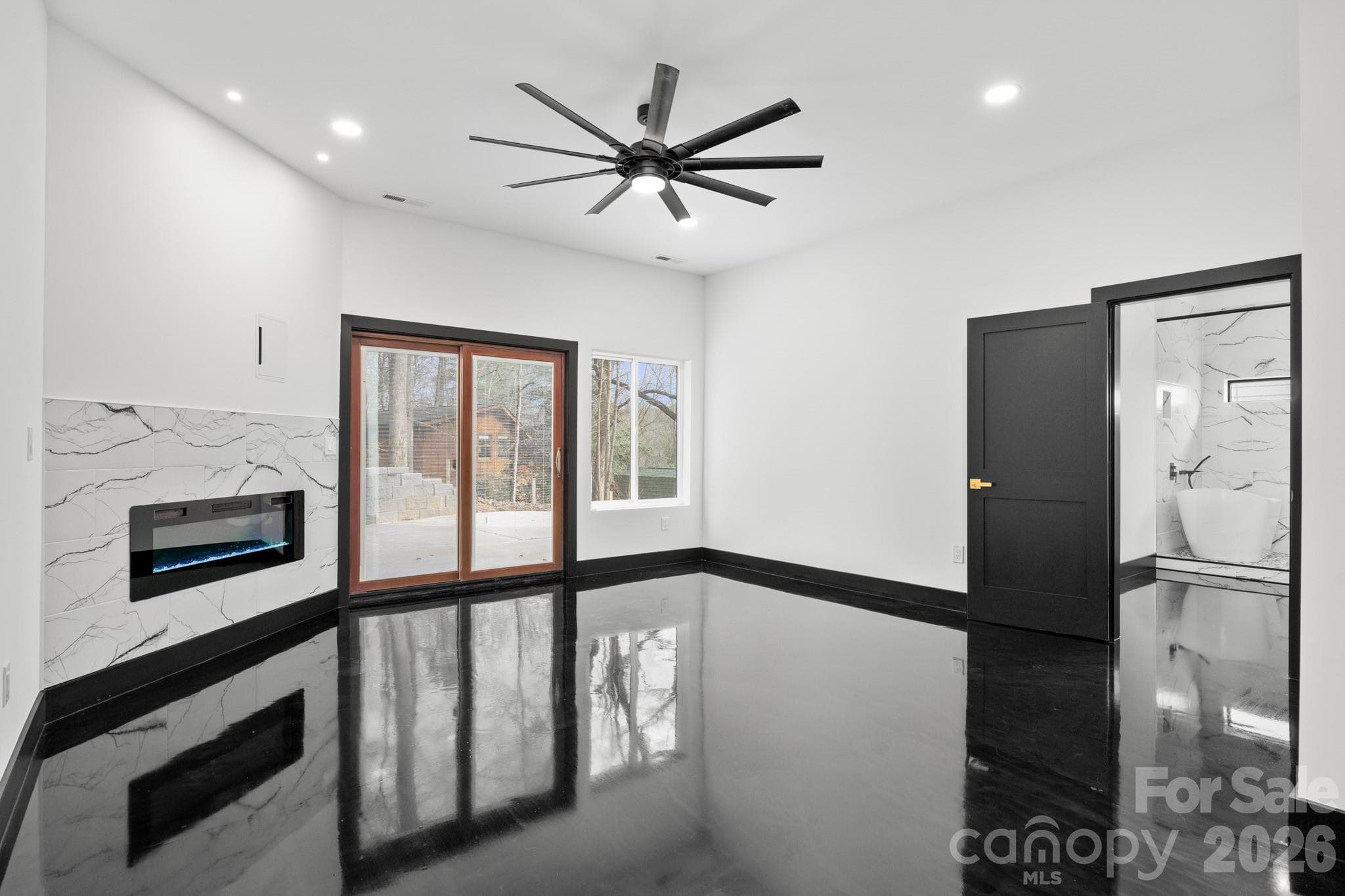 Lower level bedroom with walk out patio/ hot tub area - 74 Jeranna Road, Mills River