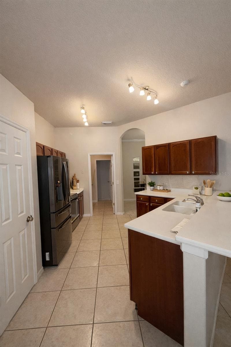Kitchen. AI Staged - 6002 RENAISSANCE CT, ST CLOUD