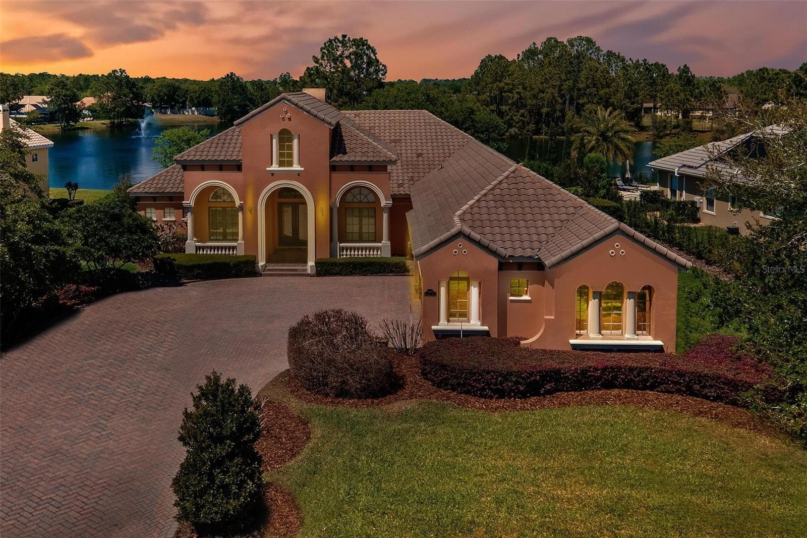 FRONT EVENING SHOT - 3001 ISOLA BELLA BLVD, MOUNT DORA