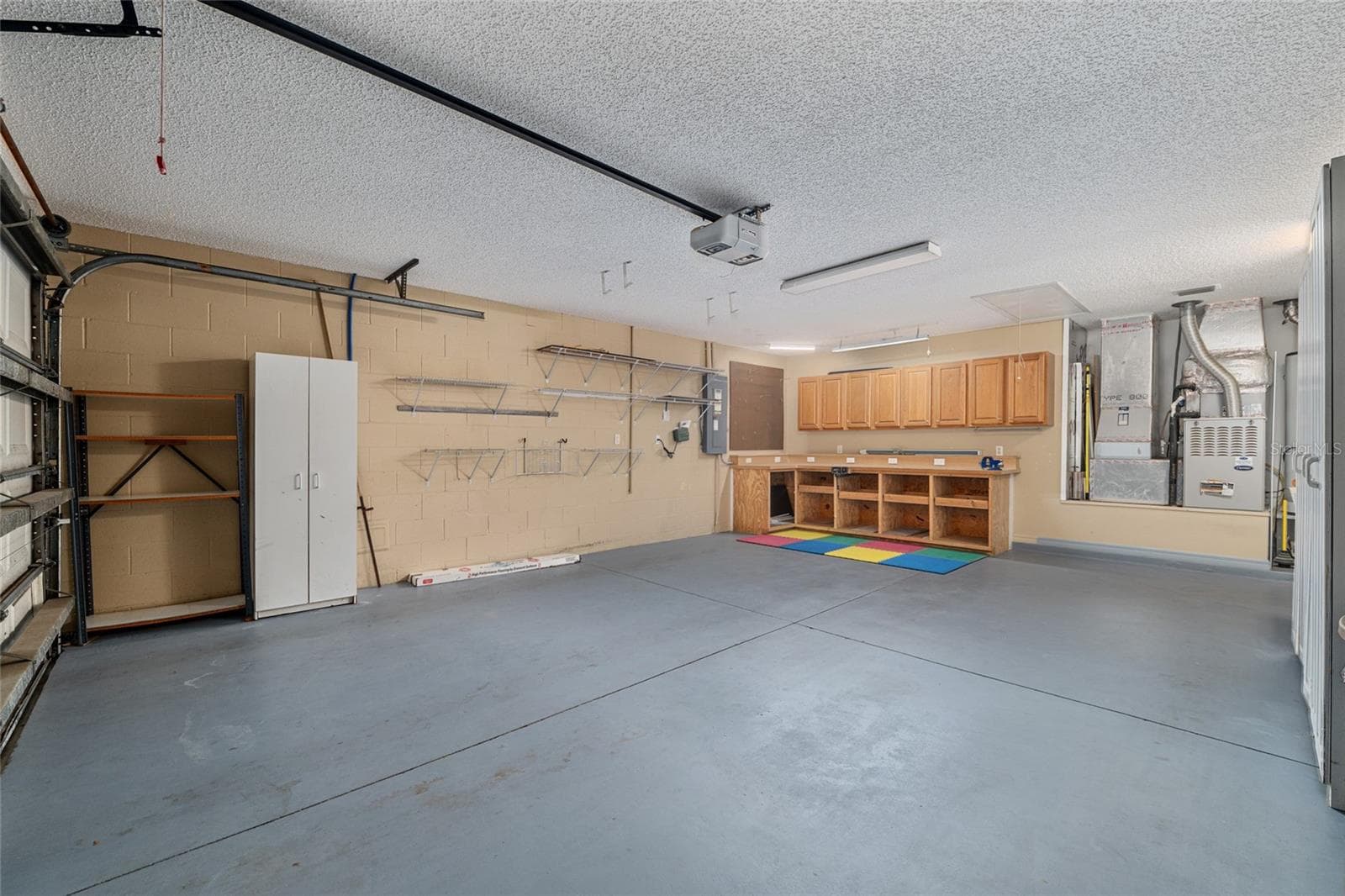 Garage (Alternate View): Large garage layout offers ample room for vehicles, storage, and flexible use. - 110 CHULA VISTA AVE, LADY LAKE