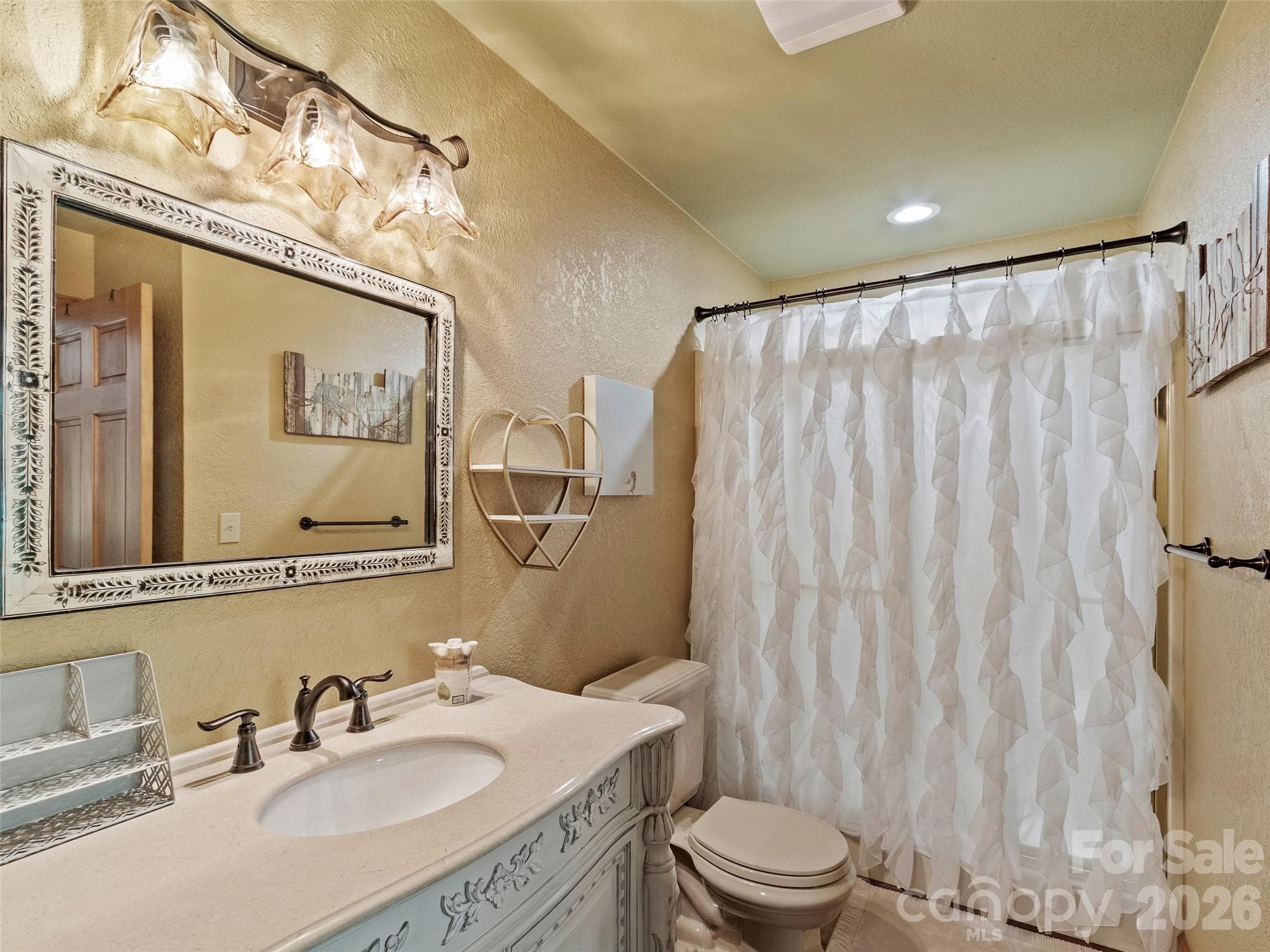 Charming full bath with stylish custom vanity - 151 Austin Mountain Drive, Burnsville