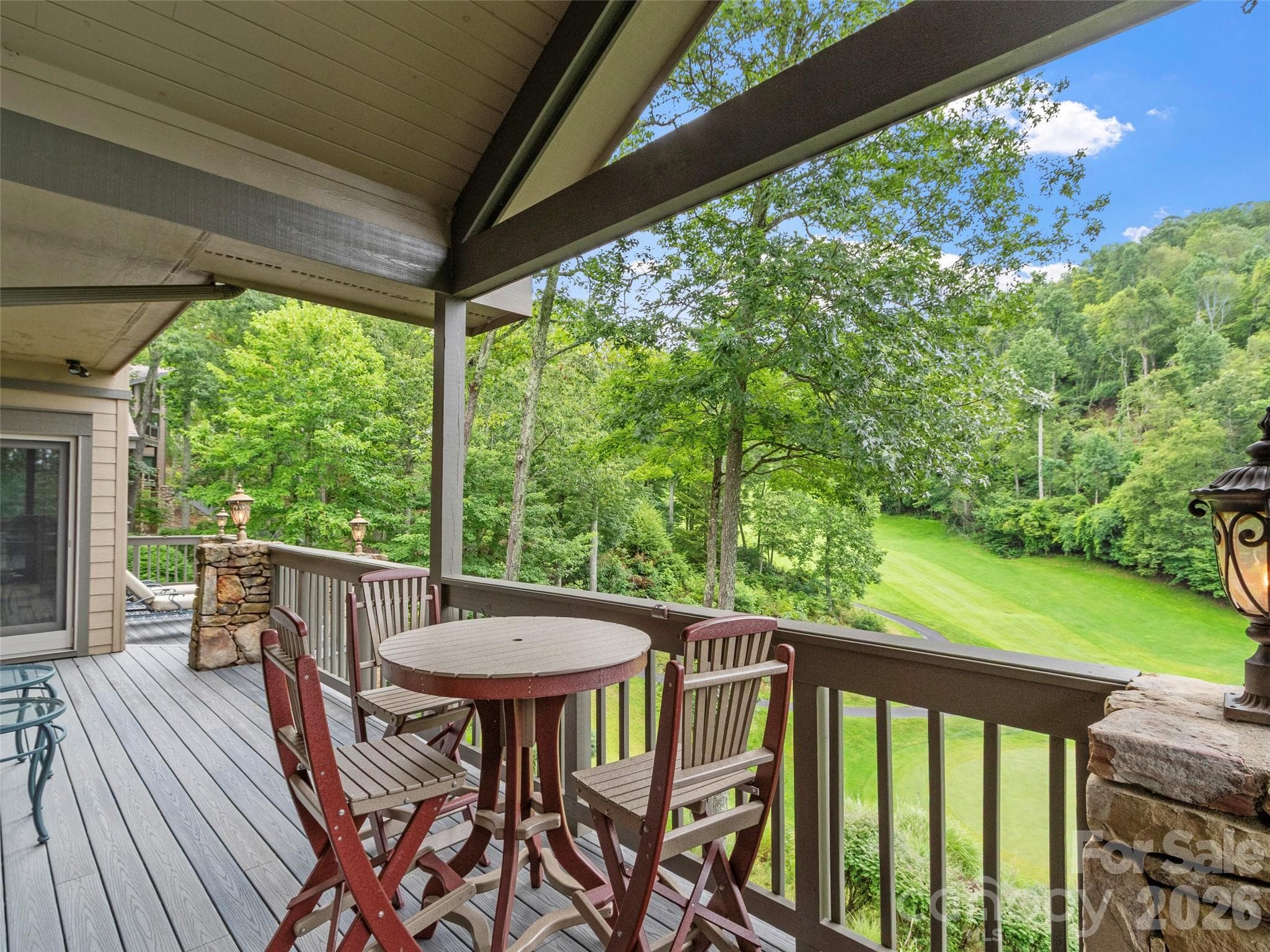 Enjoy lunch on the deck while watching golfers on the fairway - 151 Austin Mountain Drive, Burnsville