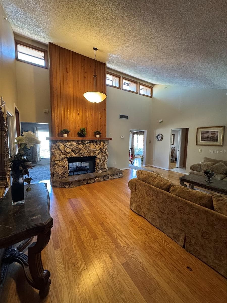 WOOD BURNING FIREPLACE SHOWING ACCESS TO SUNKEN LIVING RM - 4504 CRIMSON CT, ORLANDO