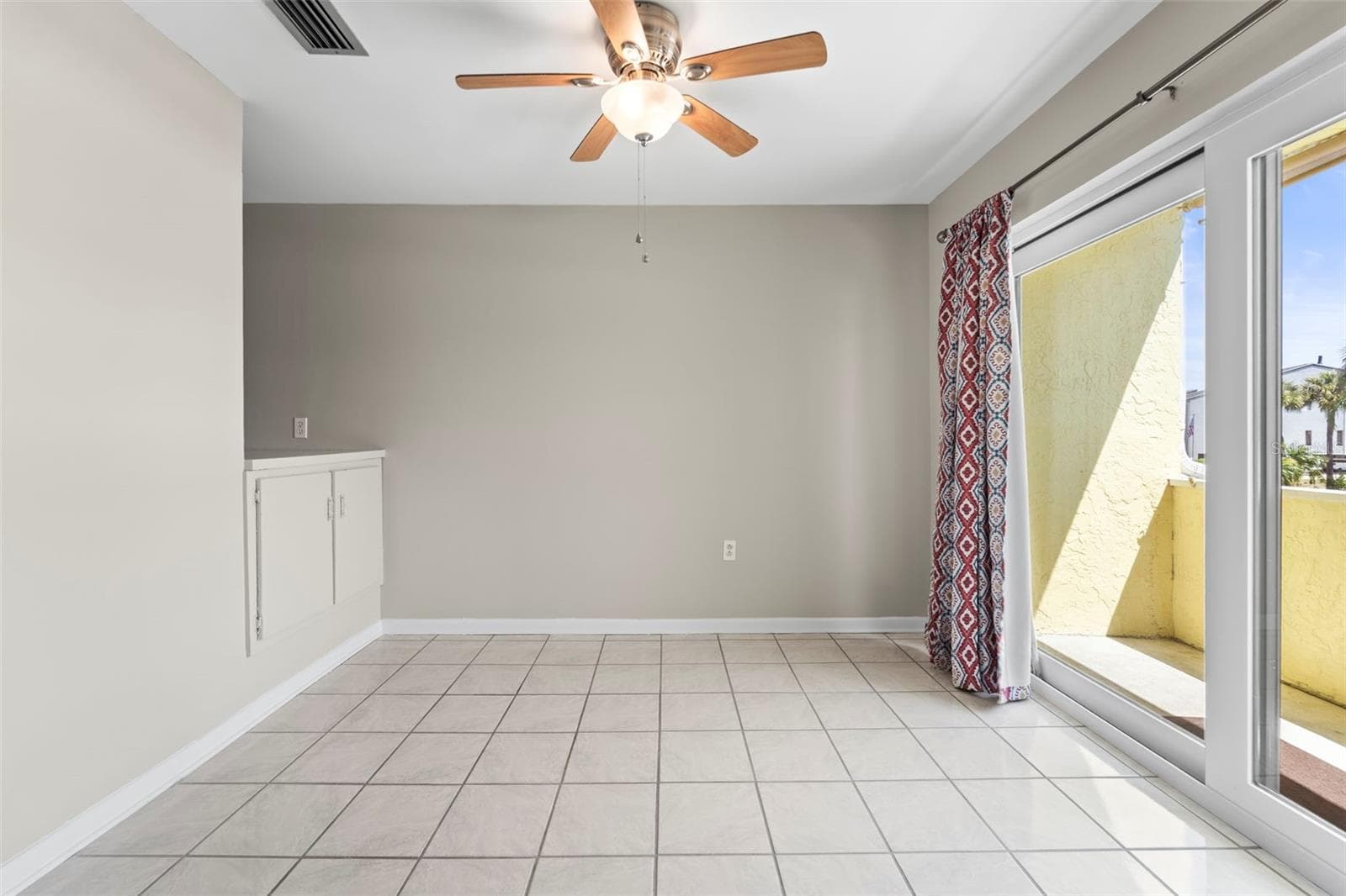 Dining area with patio Doors to the open porch area - 1 WINDRUSH BLVD #24, INDIAN ROCKS BEACH