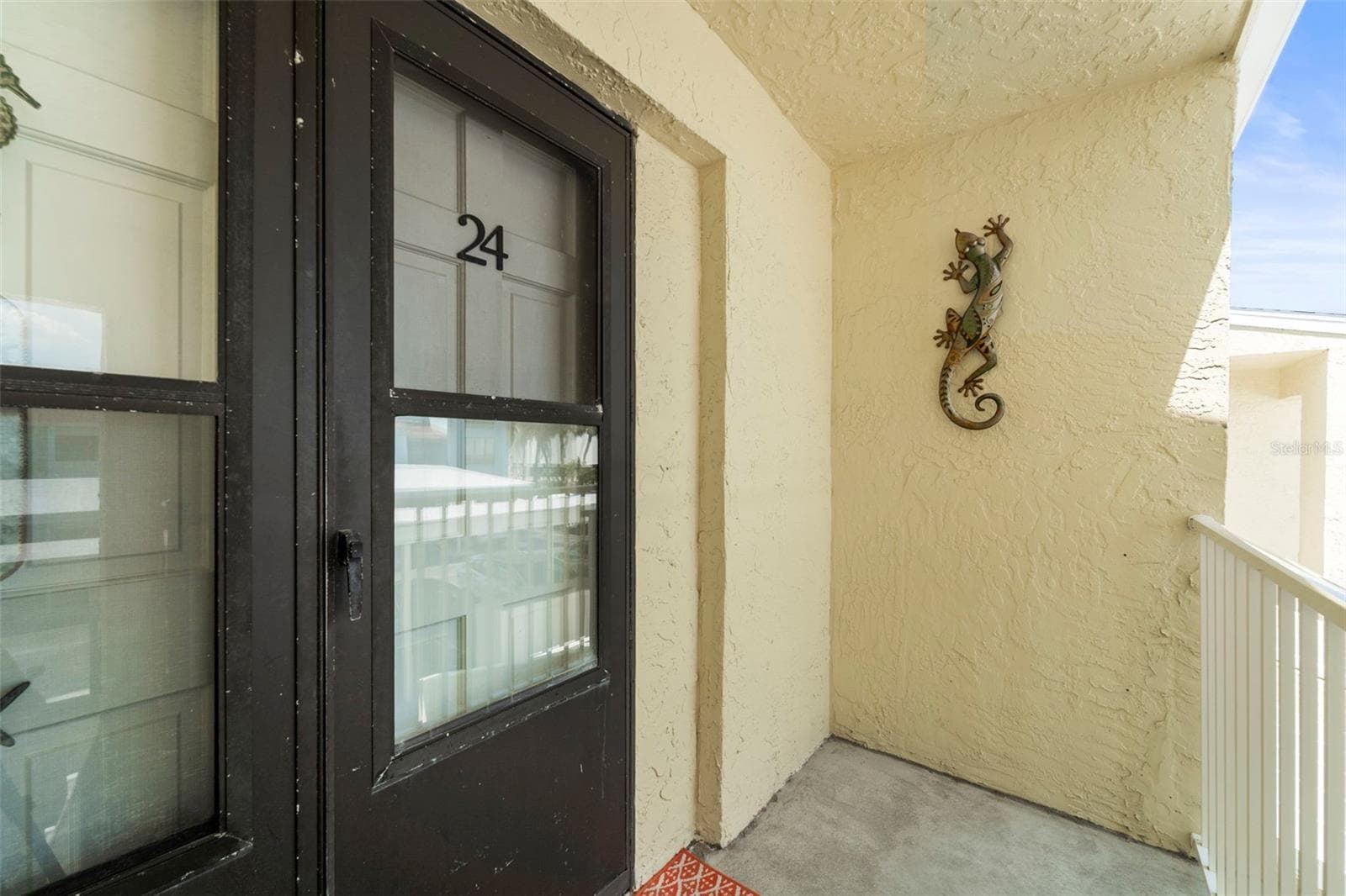 Front door and open porch - 1 WINDRUSH BLVD #24, INDIAN ROCKS BEACH