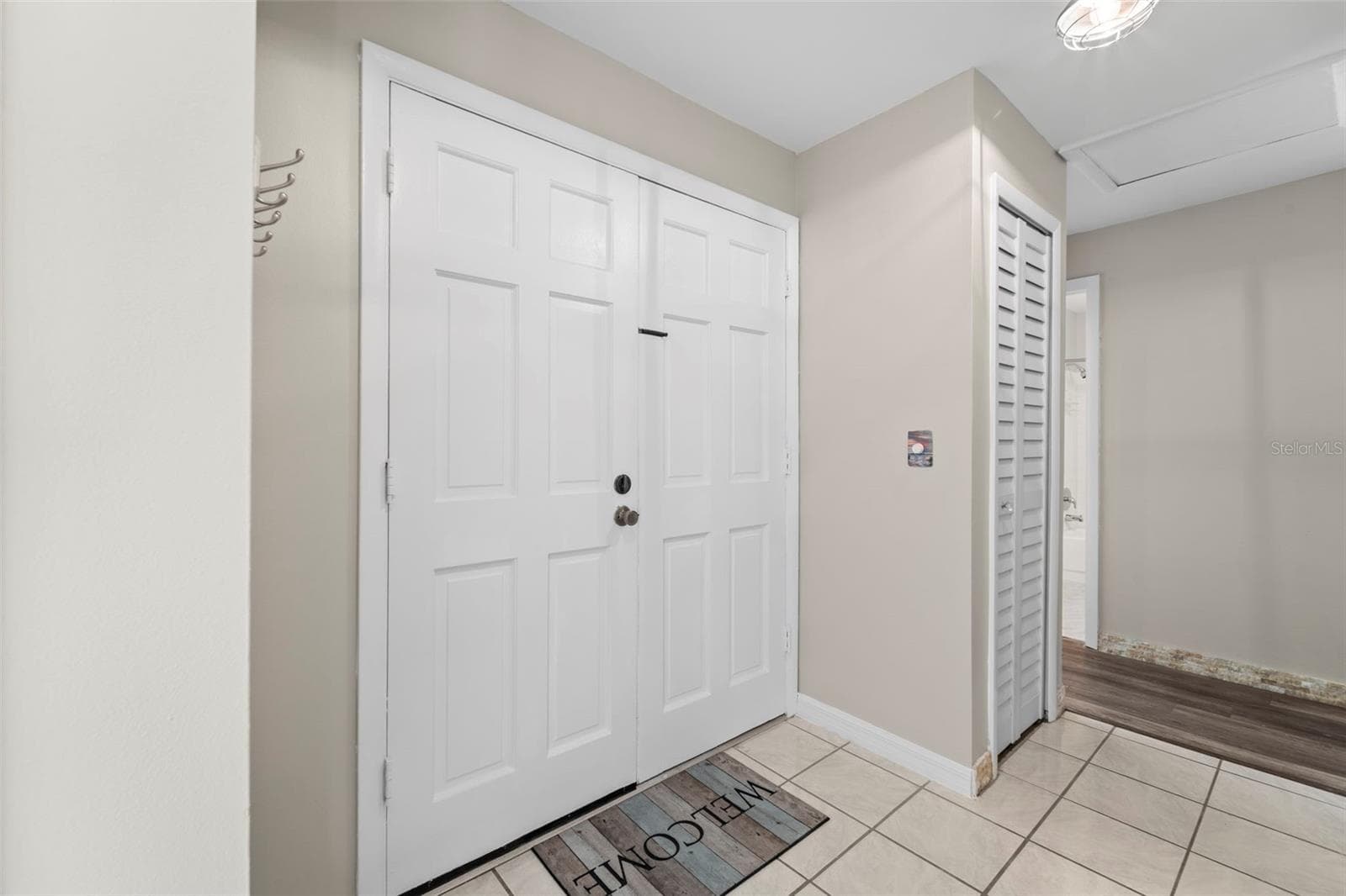Inside the front door...showing a nearby closet - 1 WINDRUSH BLVD #24, INDIAN ROCKS BEACH