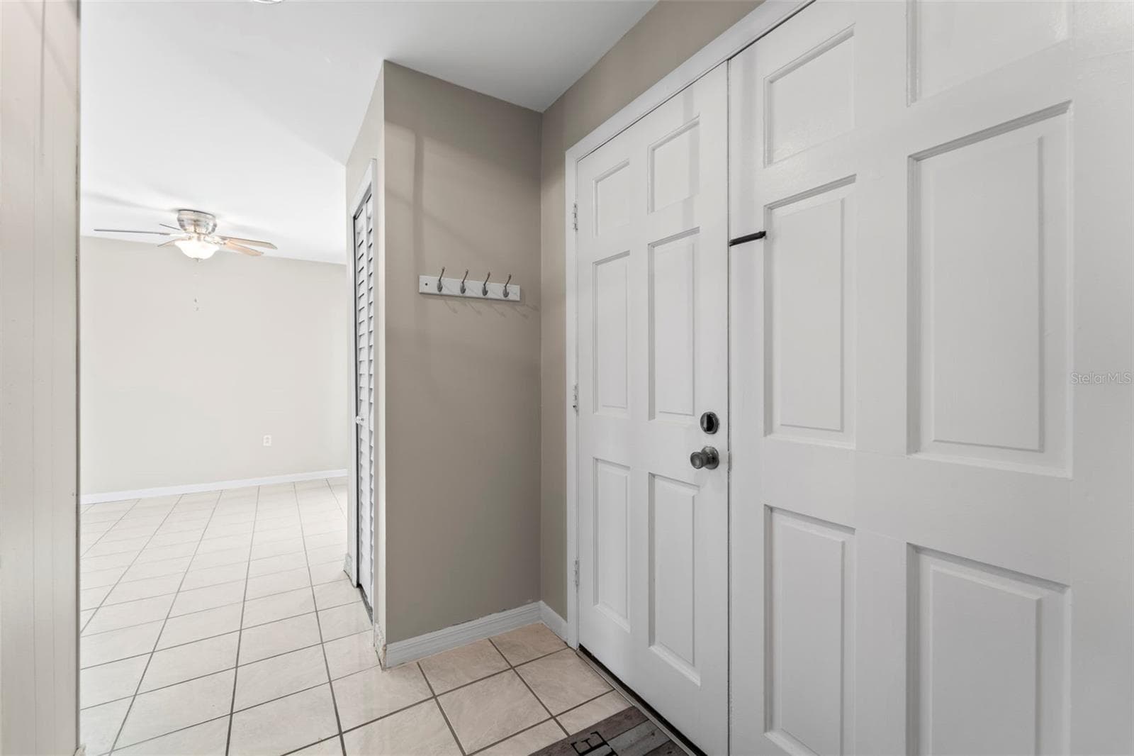 From front door area looking into the dining area - 1 WINDRUSH BLVD #24, INDIAN ROCKS BEACH