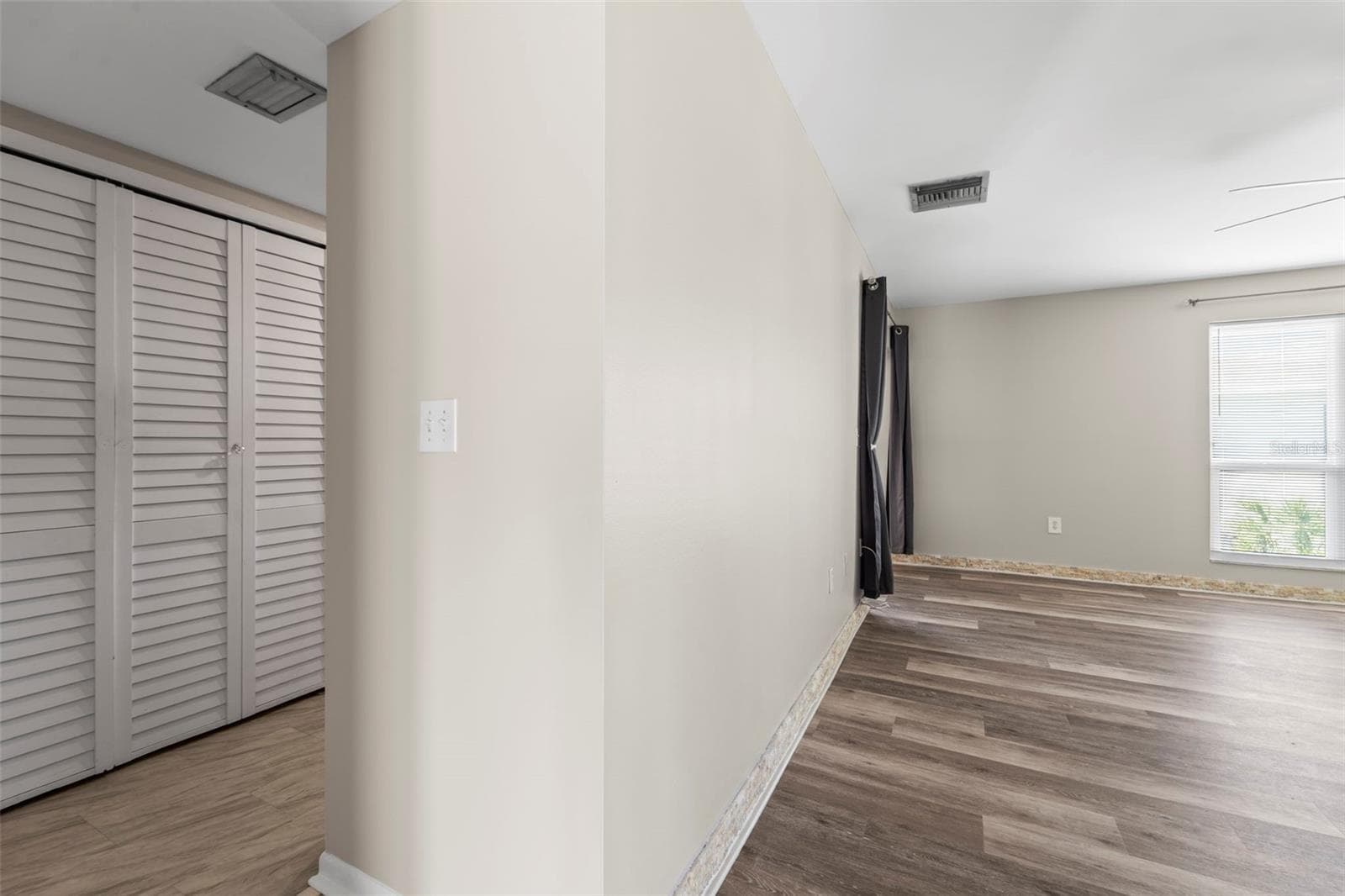 Kitchen on the left and living room on the right - 1 WINDRUSH BLVD #24, INDIAN ROCKS BEACH