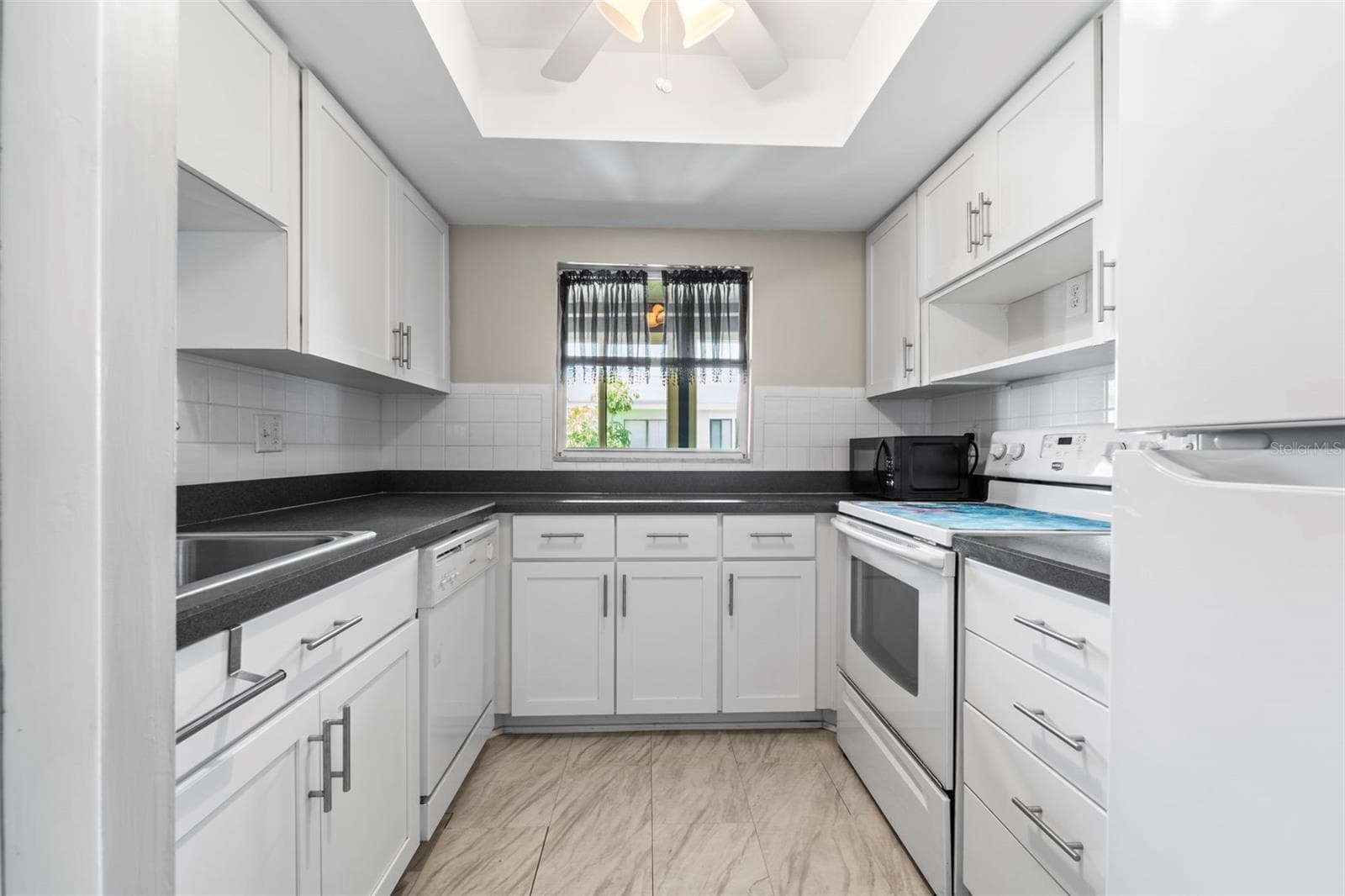 Kitchen cabinets and counters - 1 WINDRUSH BLVD #24, INDIAN ROCKS BEACH