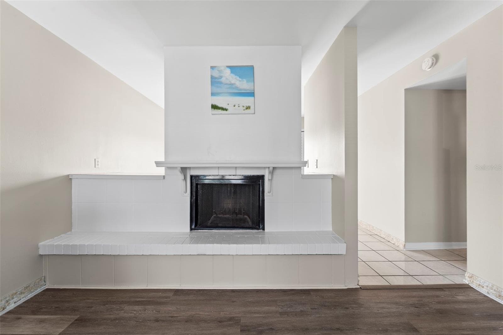 Living room complete with new flooring....and cozy fireplace - 1 WINDRUSH BLVD #24, INDIAN ROCKS BEACH