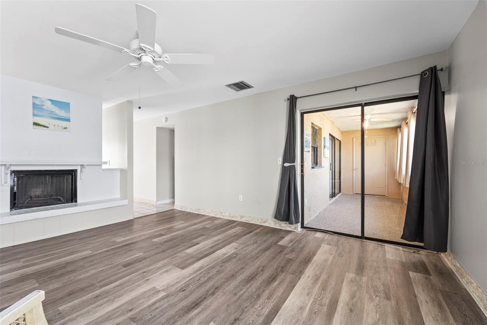 Another view of the living room - 1 WINDRUSH BLVD #24, INDIAN ROCKS BEACH