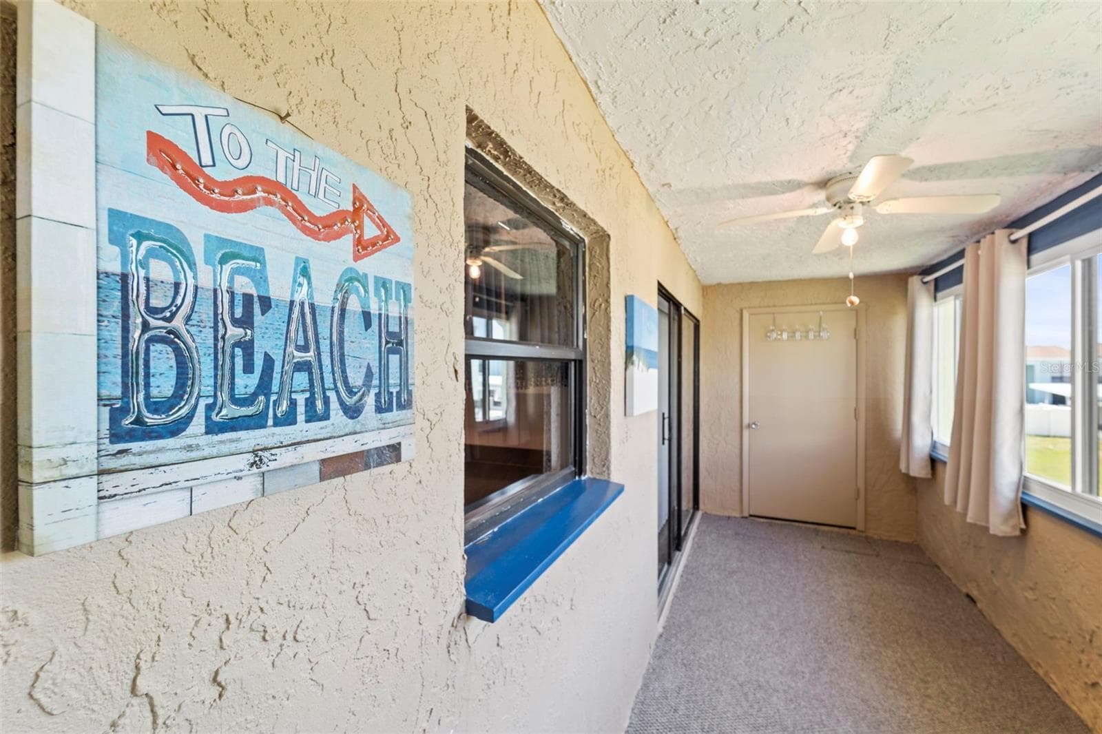 Back porch that opens from the living room and the master bedroom - 1 WINDRUSH BLVD #24, INDIAN ROCKS BEACH