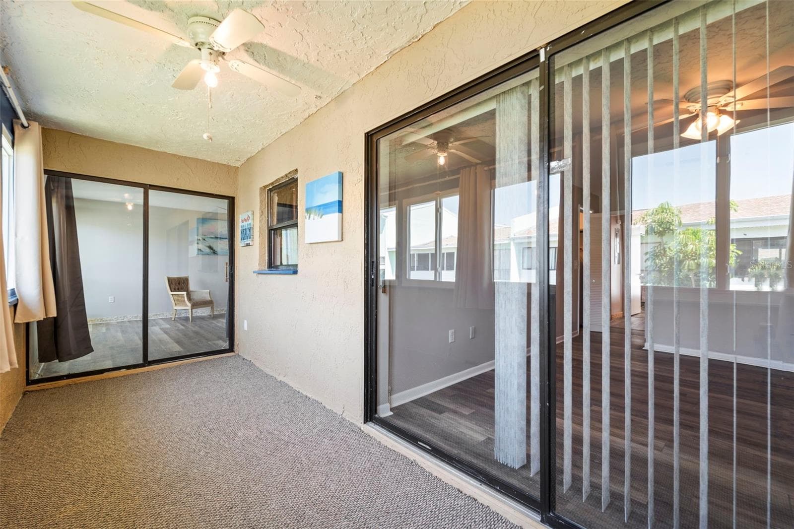 In the corner of the back porch facing the living roon on the left and master bedroom sliders on the right.. - 1 WINDRUSH BLVD #24, INDIAN ROCKS BEACH
