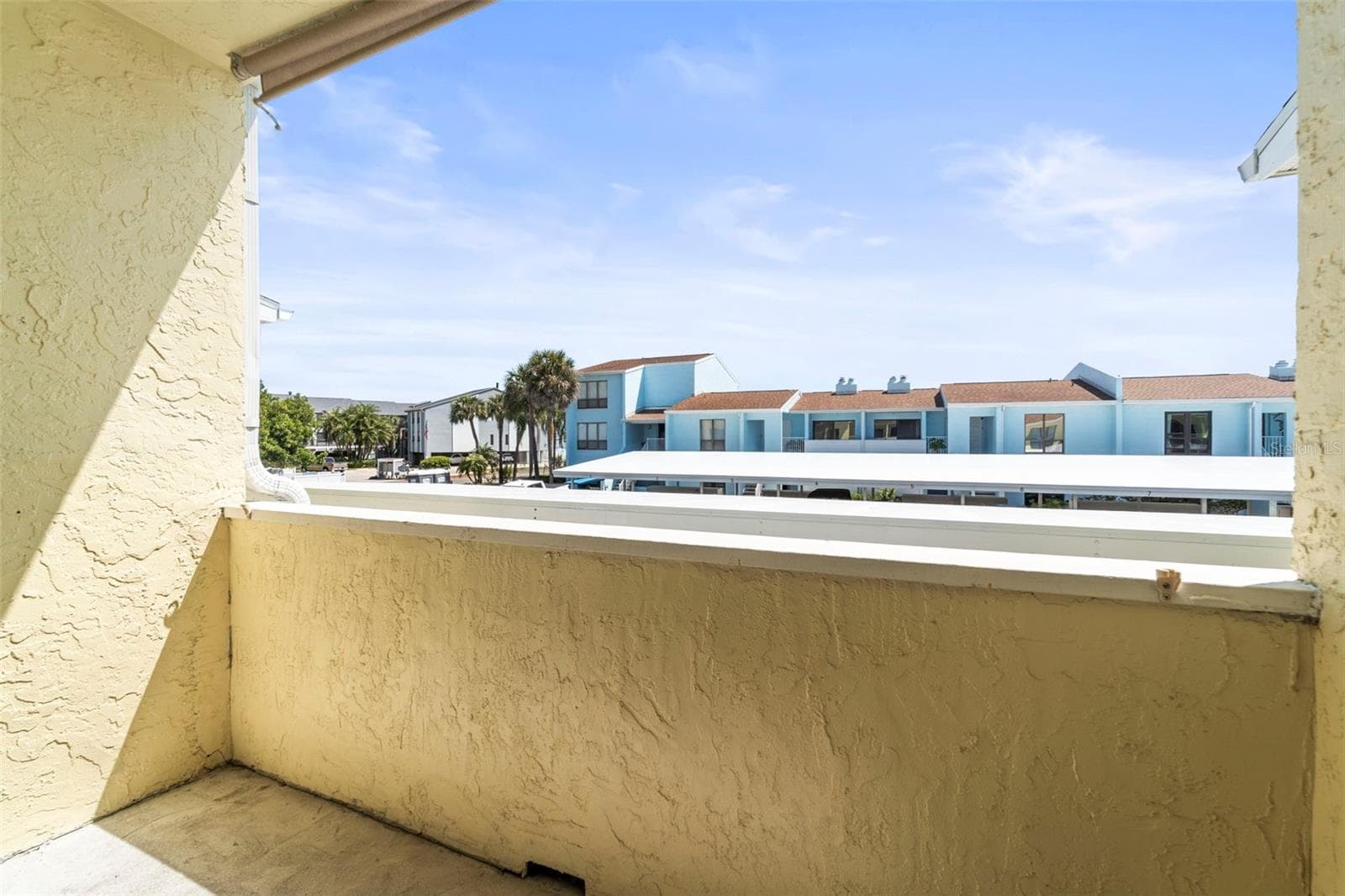 Open porch near front door - 1 WINDRUSH BLVD #24, INDIAN ROCKS BEACH