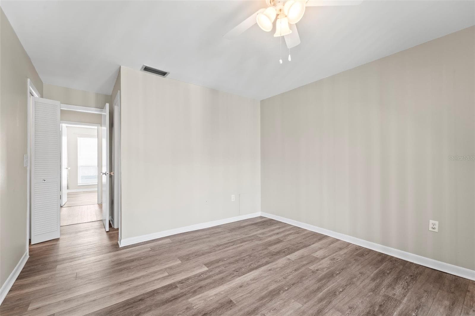 From primary bedroom looking into hallway - 1 WINDRUSH BLVD #24, INDIAN ROCKS BEACH