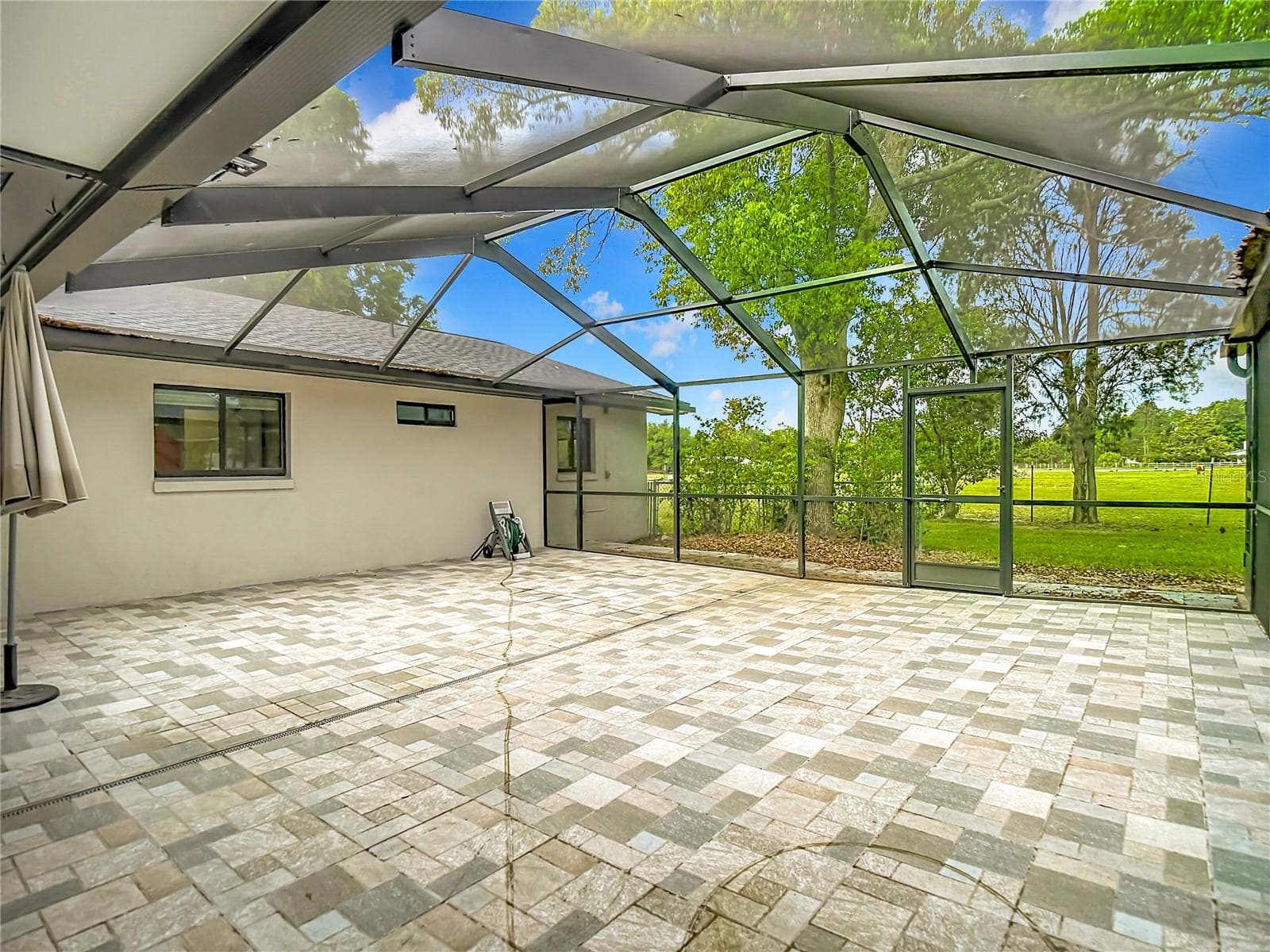extended brick paver lanai area - 216 CORBETT RD, LITHIA