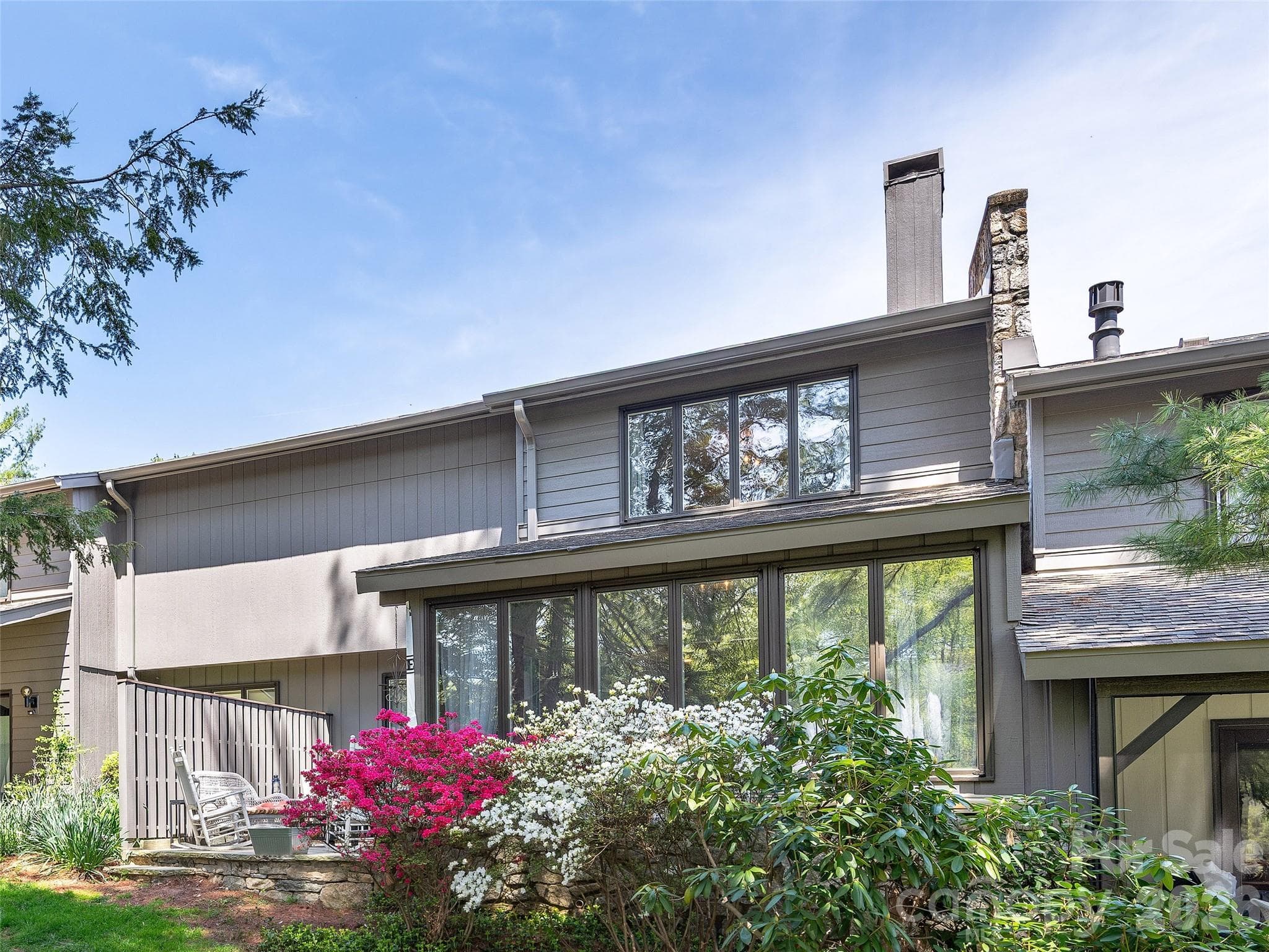 Exterior of Back Patio & Azaleas at Sunroom window. - 521 Crowfields Lane, Asheville