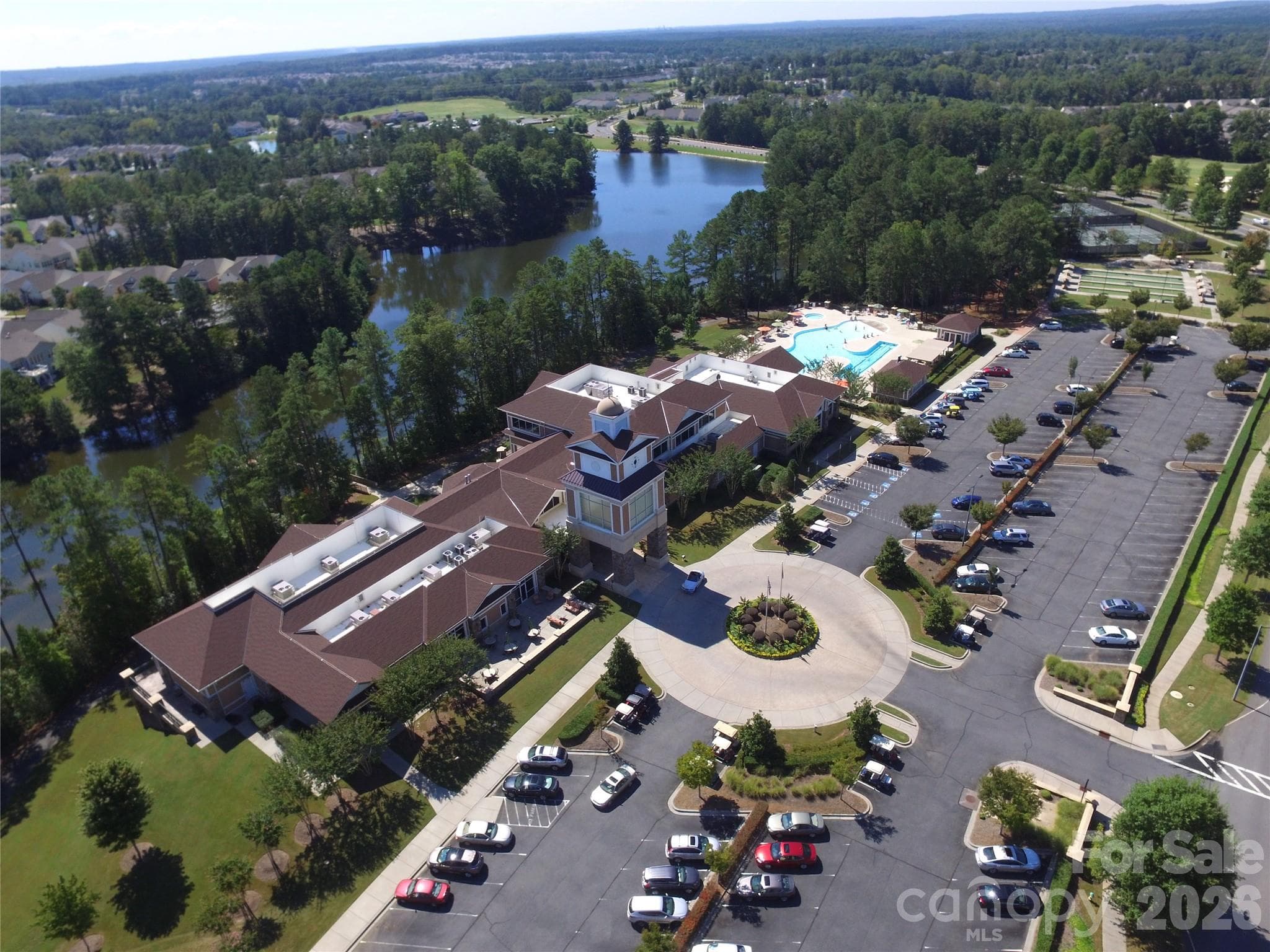 The Lake House is the main hub of the community and boasts a beautiful lobby with fireplace and view of the lake, 2-story state-of-the-art fitness center, billiards, cards, table tennis areas, card & meeting rooms, large ballroom for social events and other community activities, a covered event pavilion, a fabulous pottery studio, shuffleboard courts, and indoor and outdoor swimming pools. - Indian Land