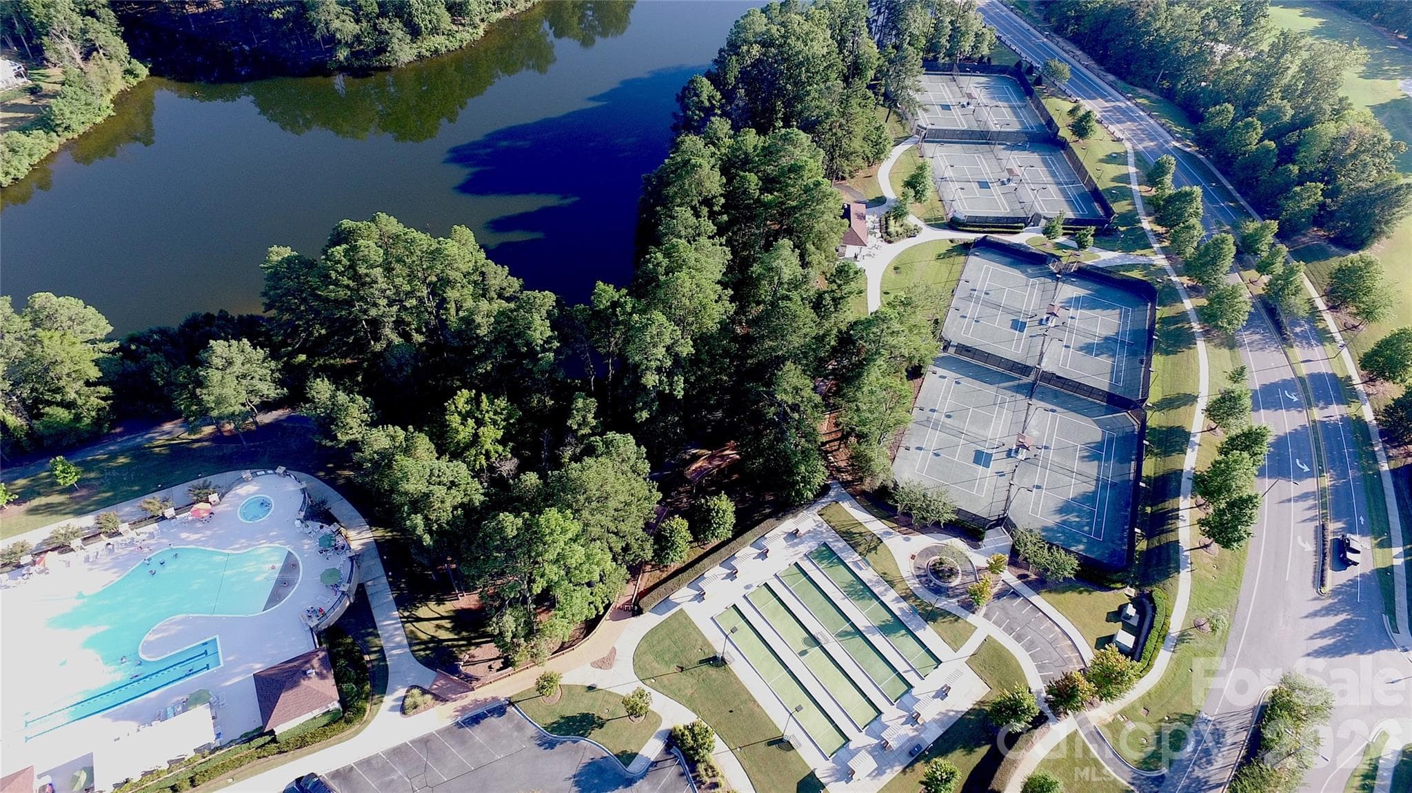 Bocce and tennis courts can be seen as you drive along Del Webb Boulevard. Pickleball courts can be found on the other side of The Lake House, as well as at The Lodge, and Water's Edge Park. - Indian Land