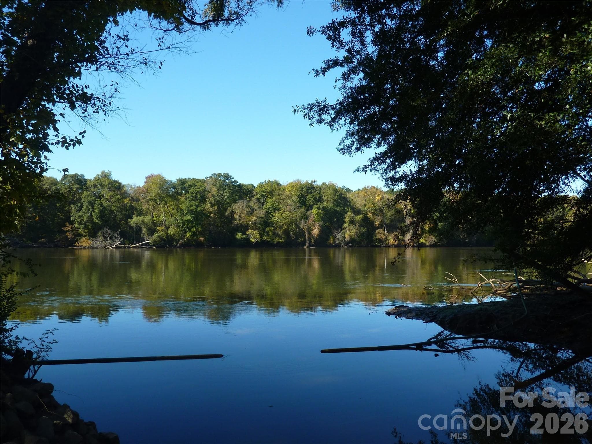 Catawba River access near the kayak center is reached via delightful walk or golf-cart ride along a tree-lined trail near Water's Edge Park. - Indian Land