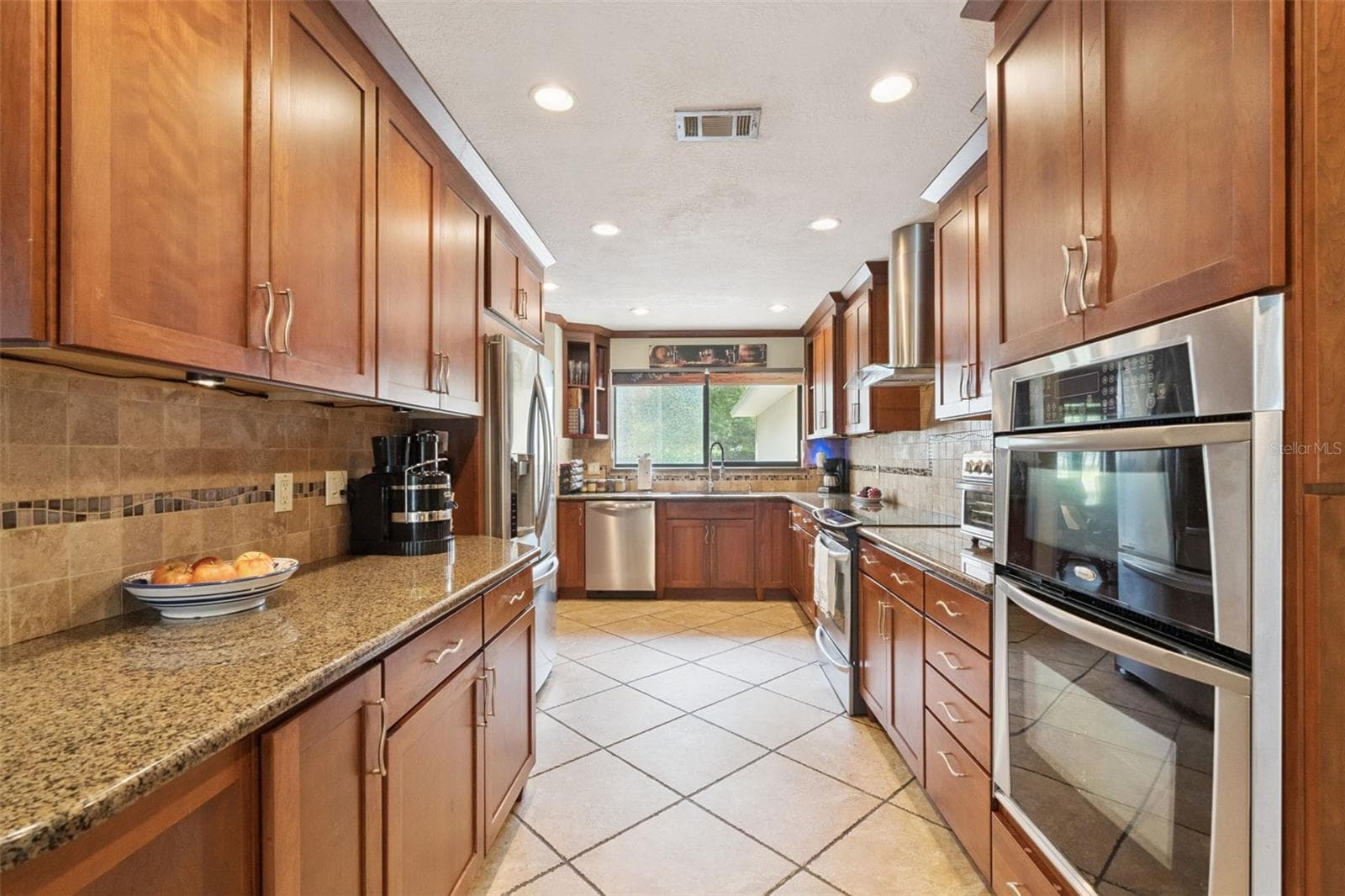 Updated Kitchen with Cherry Wood Cabinetry - 3501 HILL STREAM AVE, APOPKA