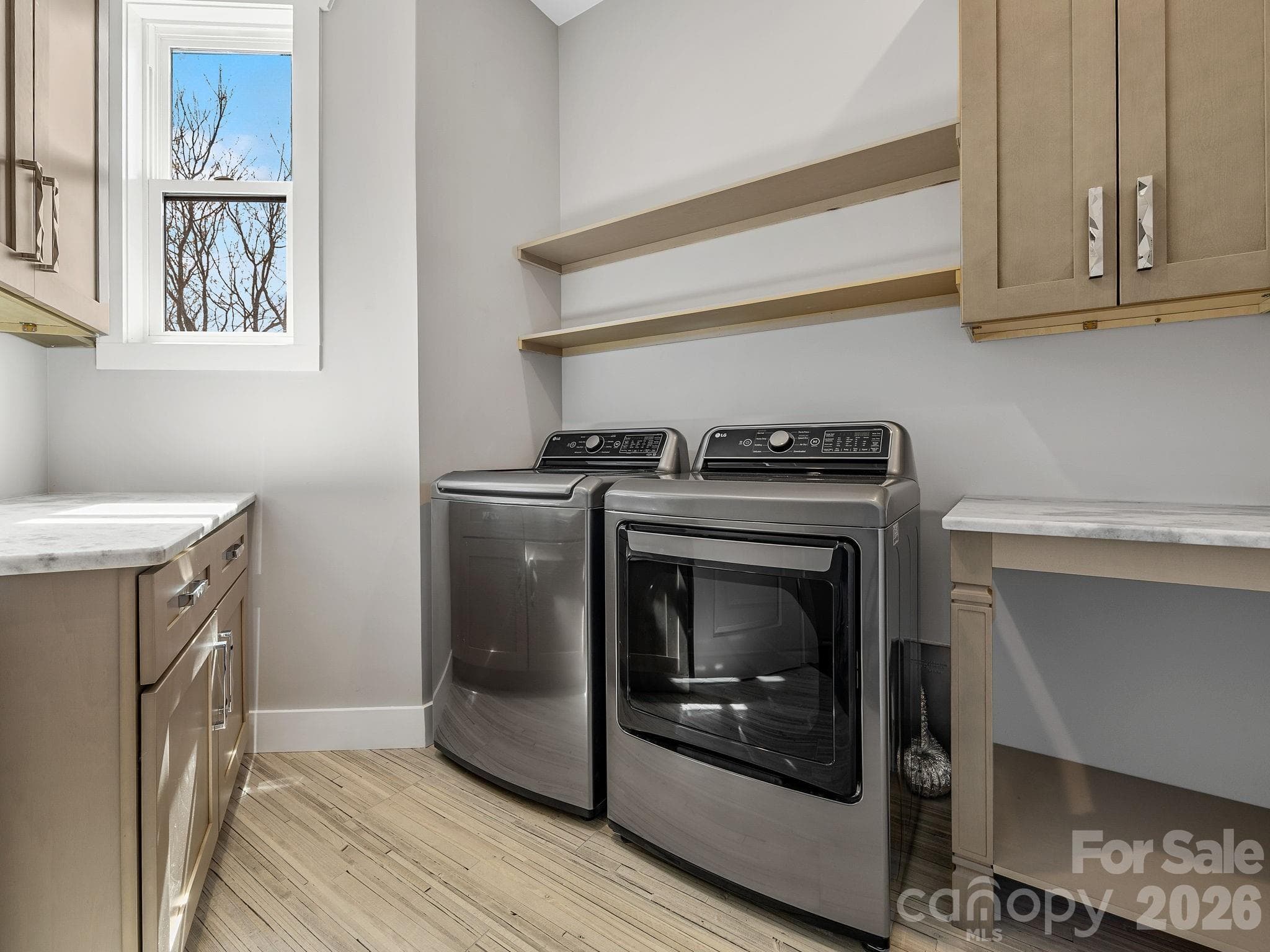 Laundry Room with ample workspace, high capacity laundry appliances and generous storage. - 345 Preservation Trail, Columbus