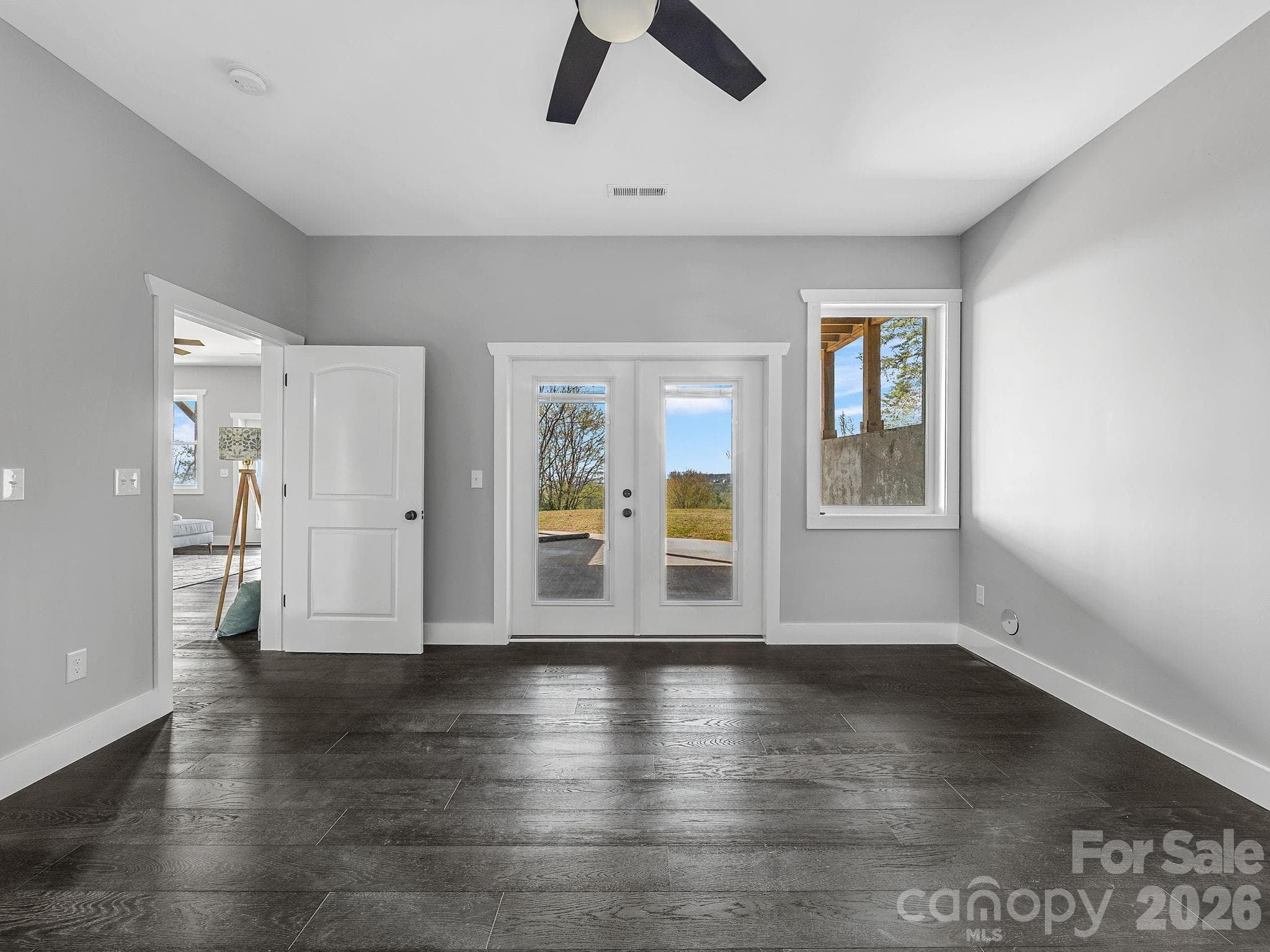 Lower level bedroom ensuite #1 with bath and outside exit to patio. - 345 Preservation Trail, Columbus