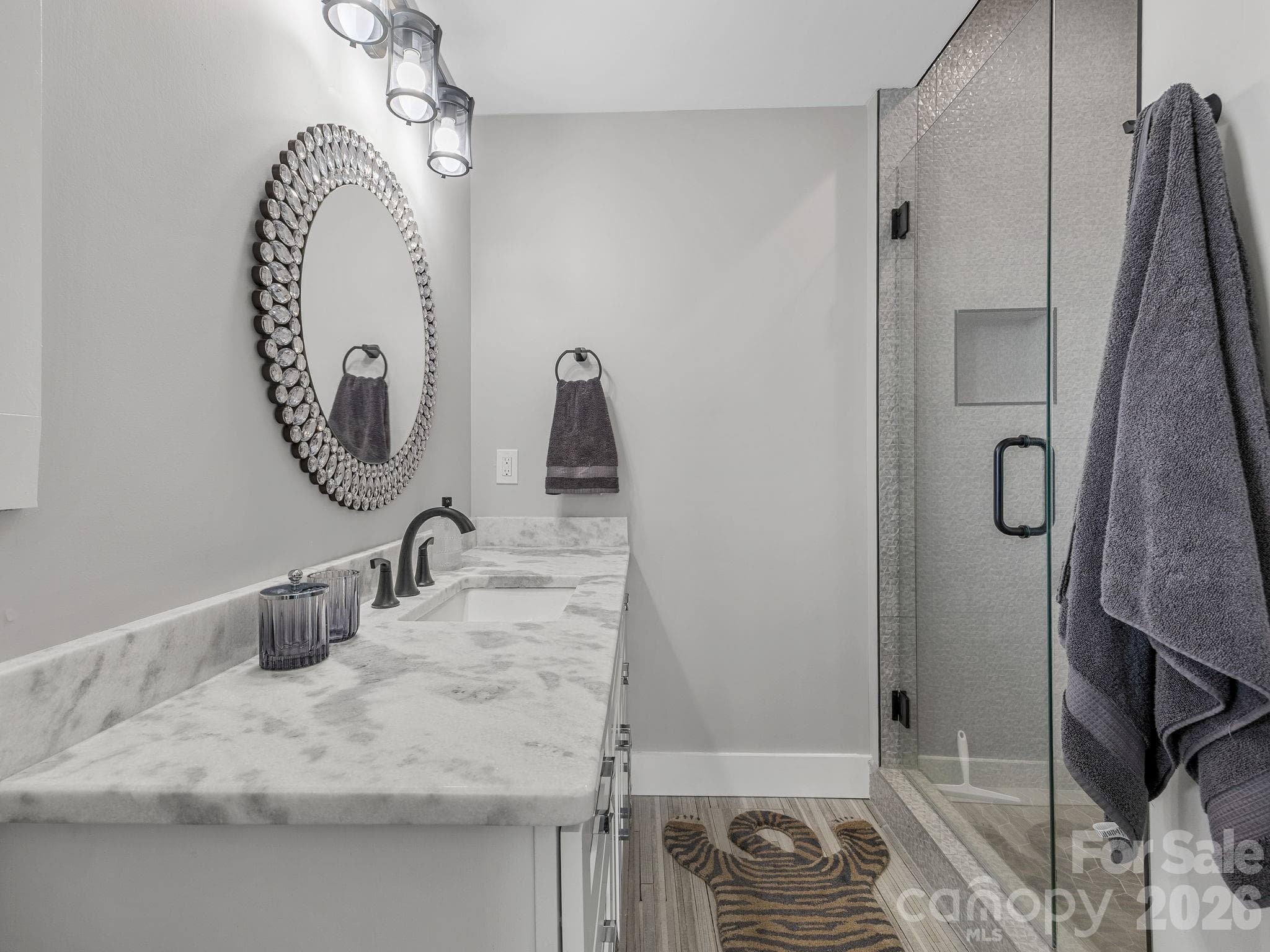 Lower level bedroom bath #2 with marble counter and glass shower. - 345 Preservation Trail, Columbus