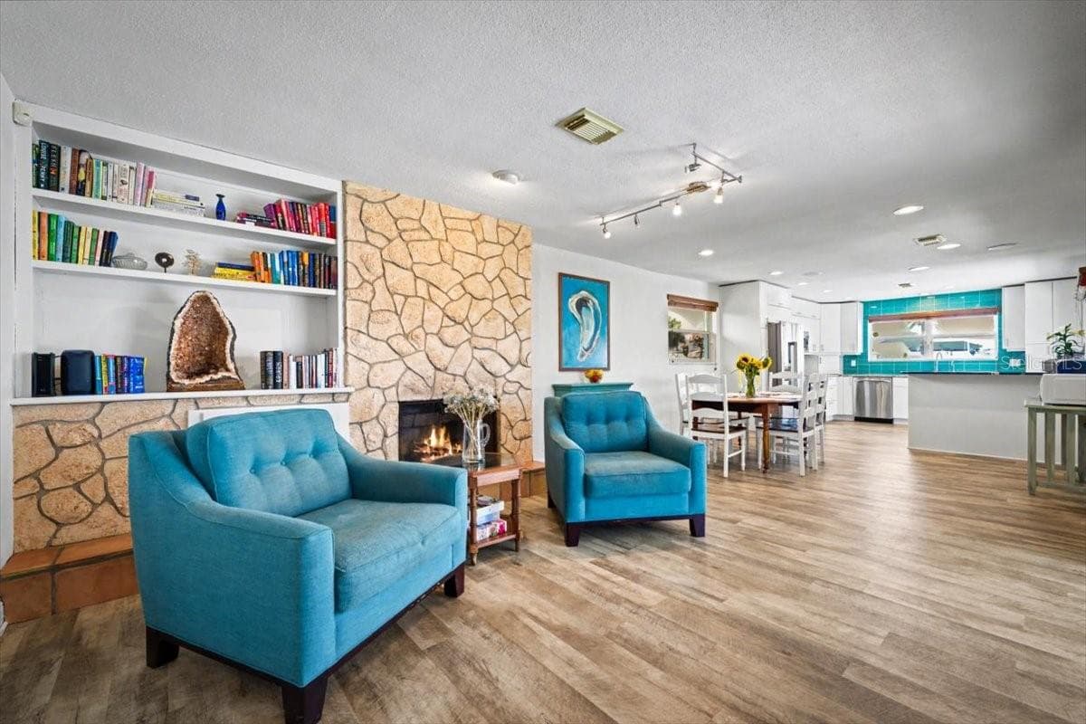 Living Area Fireplace - 124 ANCHOR DR, PONCE INLET