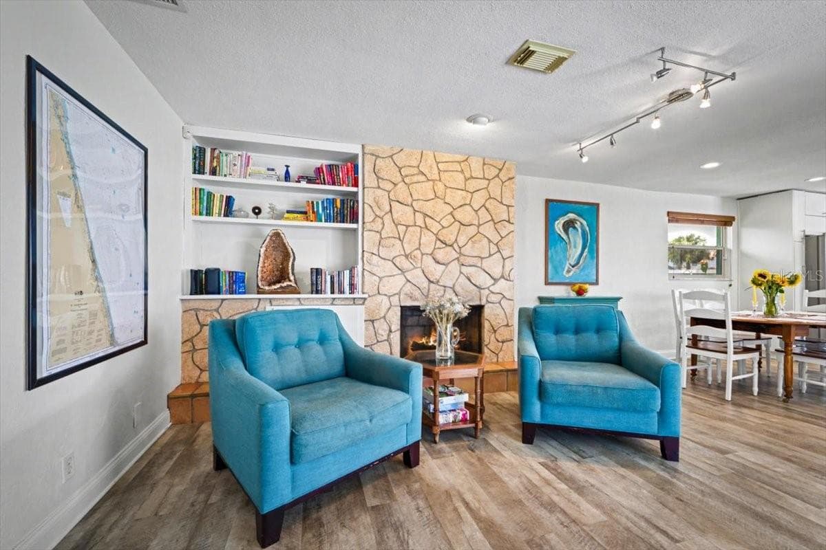 Living Area Fireplace - 124 ANCHOR DR, PONCE INLET