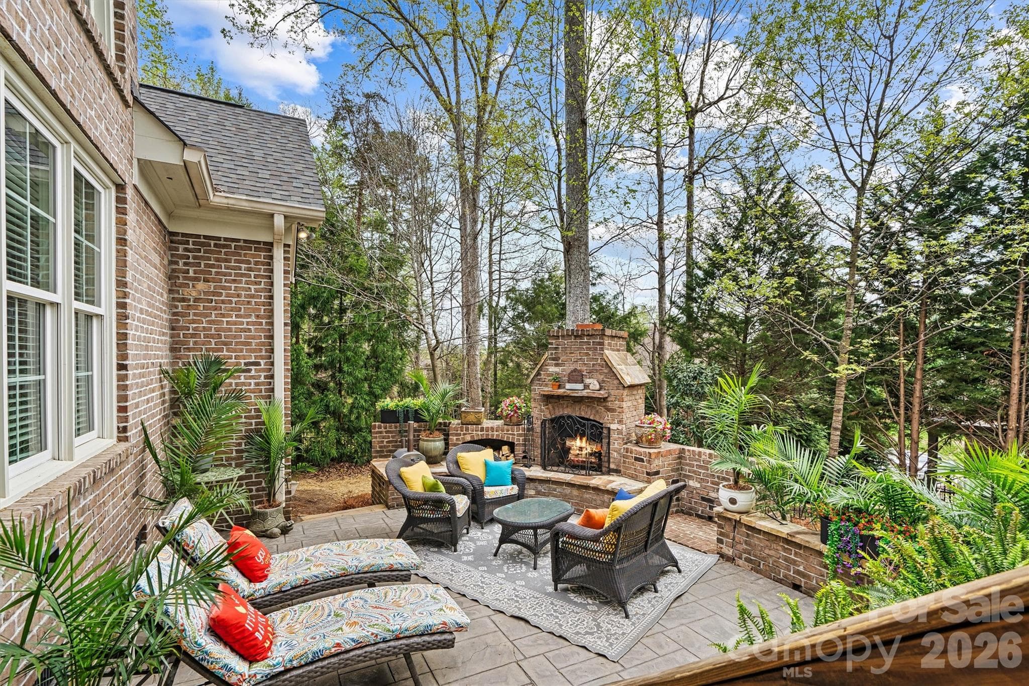 Patio with fireplace for year-round outdoor living - Stanley